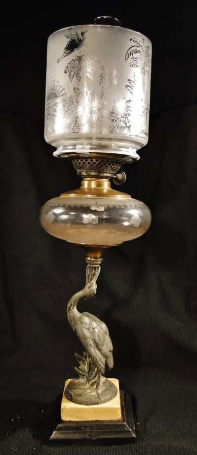 A signed Victorian stork oil lamp with crystal font: A signed Victorian stork oil lamp with crystal font and marble base. It has an acid cut-back top shade with stork decorations. Est. value $150 - 250.