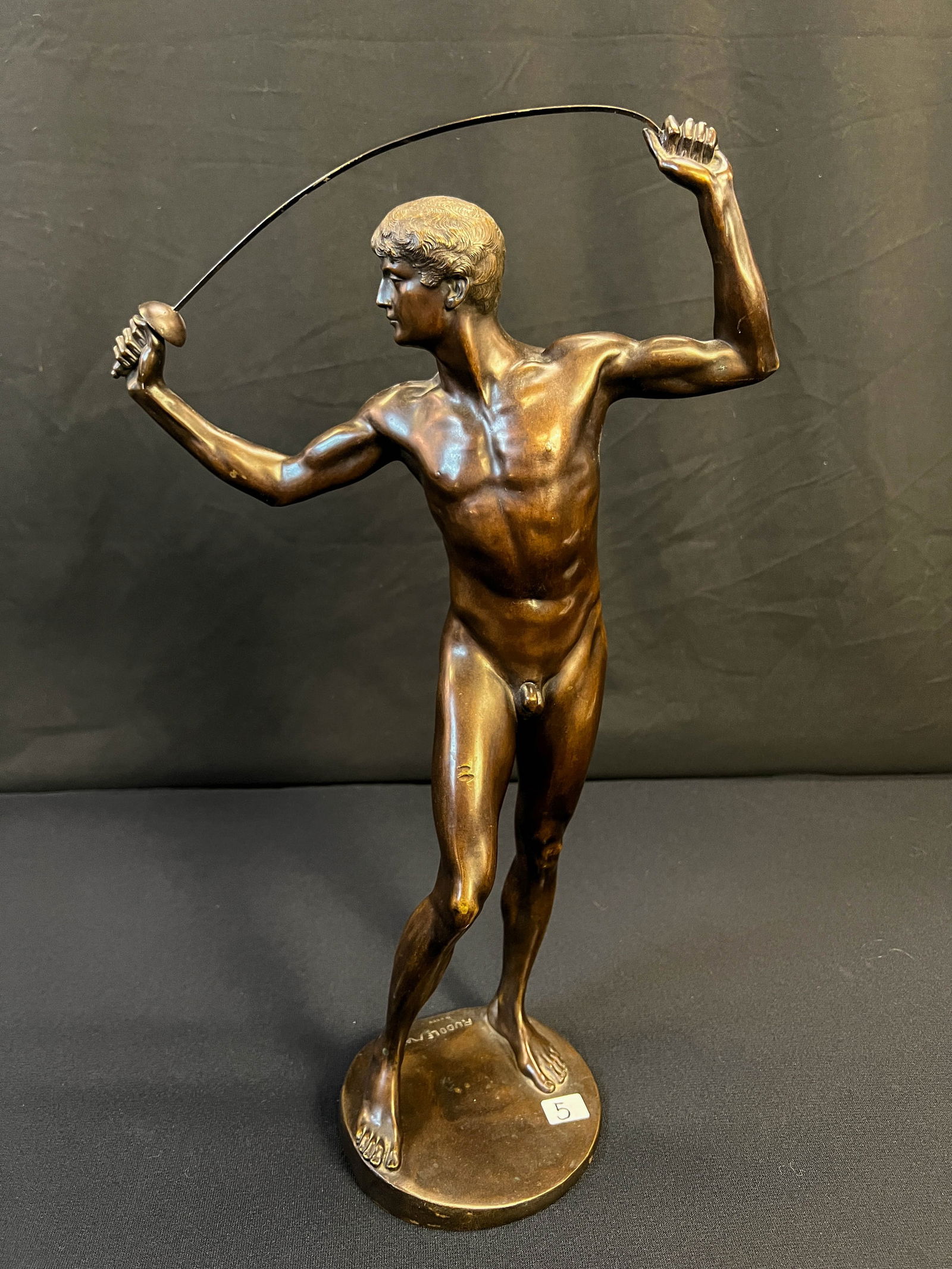 Bronze Nude with Foil by Rudolf Marcuse C. 1900, German: This turn of the century bronze nude statue depicts a nude young man flexing a fencing foil and created in Neoclassic style is by award winning German born Jewish sculptor Rudolf Marcuse (1878-1940).