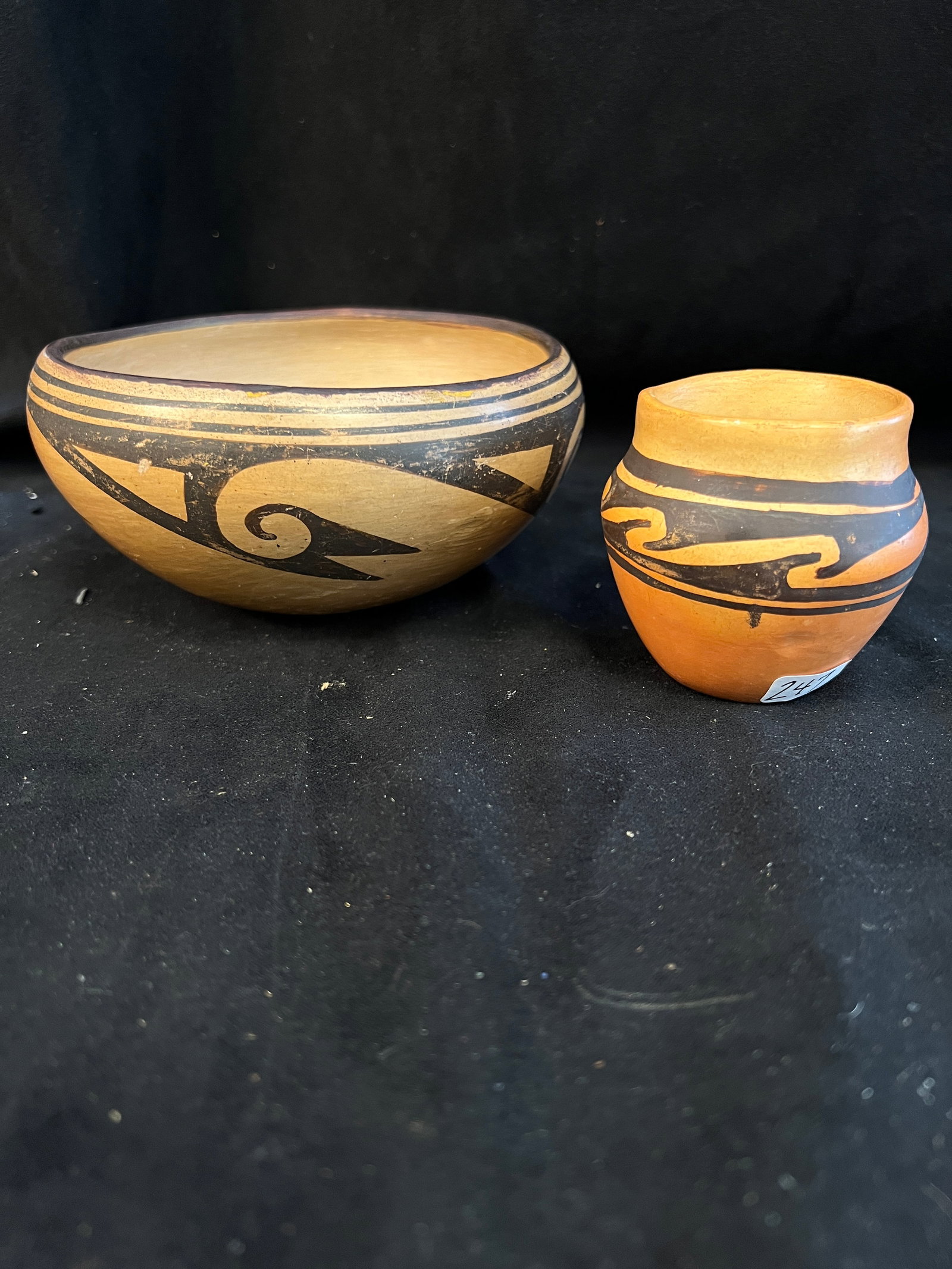 Two Hopi Native American Bowl c. 1900: A Hopi Native American bowl c. 1900 with geometric decoration that messures 6" x 4" and a smaller Hopi vessel that measures3.75" tall.