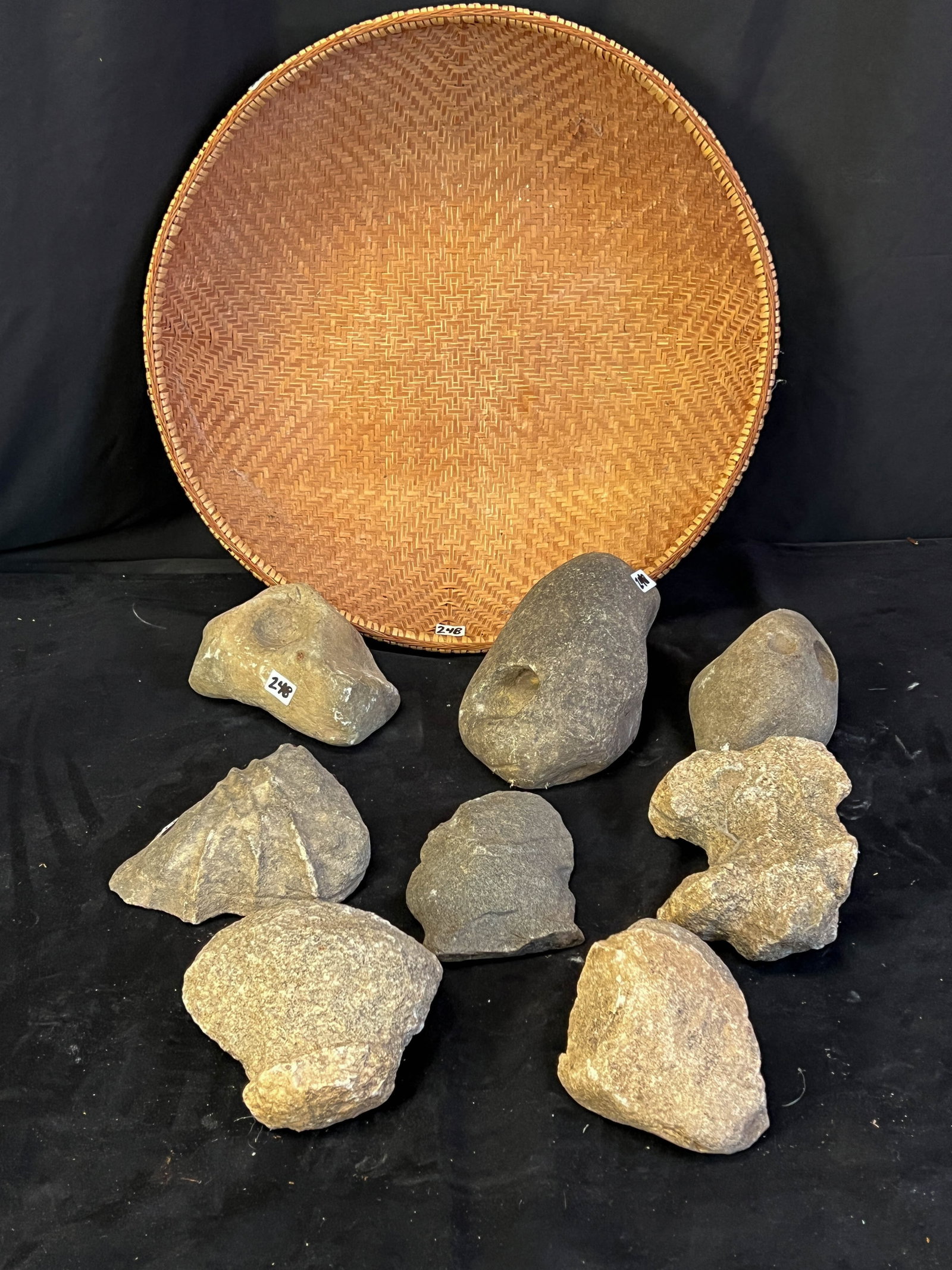 Early Native American Artifacts: This group of stone Native American artifacts were purported to have been found in the Madison, Wisconsin area. Included is a large hand made African basket in excellent condition with some age.