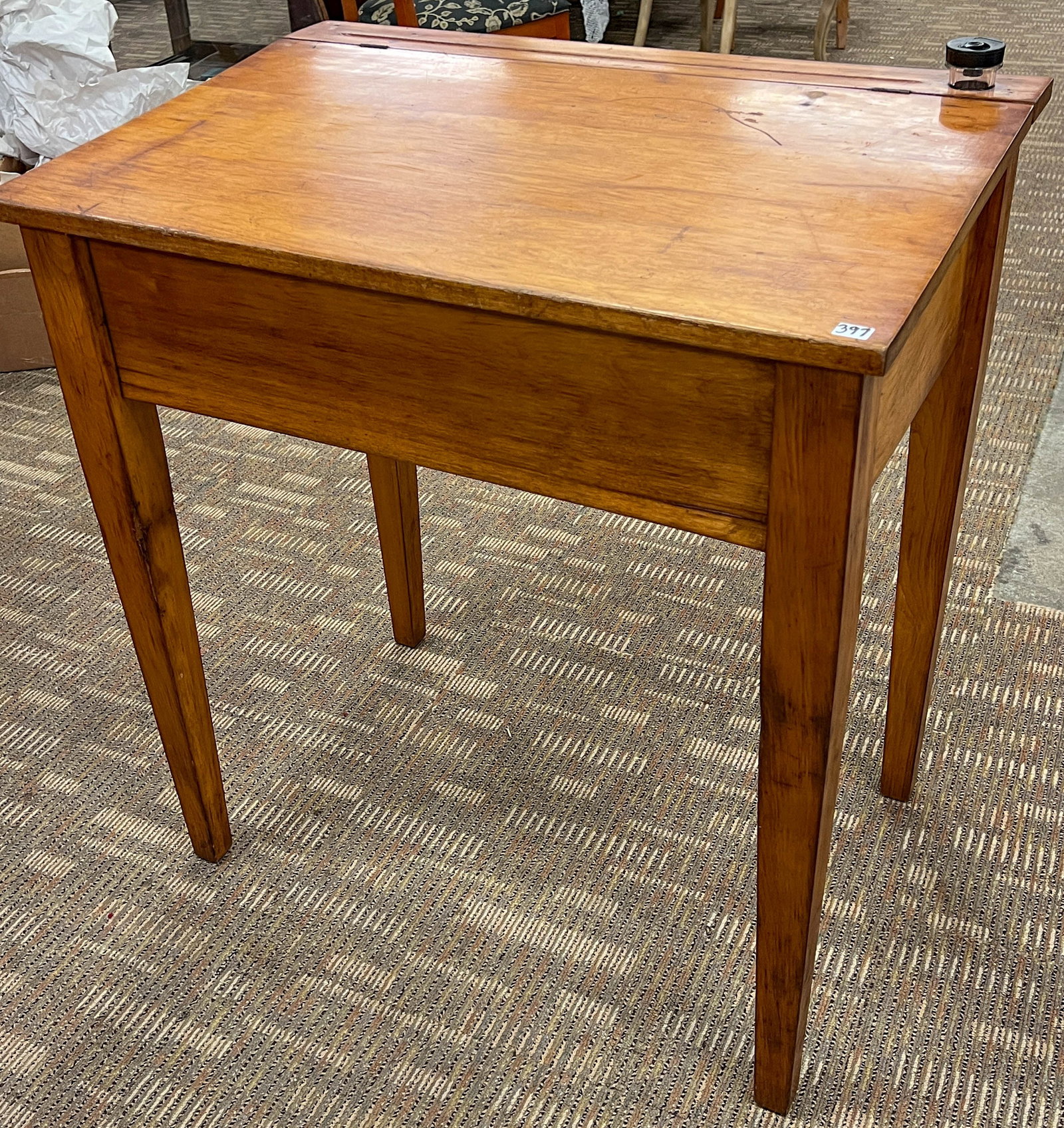 Early Shop Keepers Desk: This maple flip top early shopkeeper's desk has an inkwell, and pencil legfs. In as Found condition, it measutres 31" tall X 30" across X 20" deep.