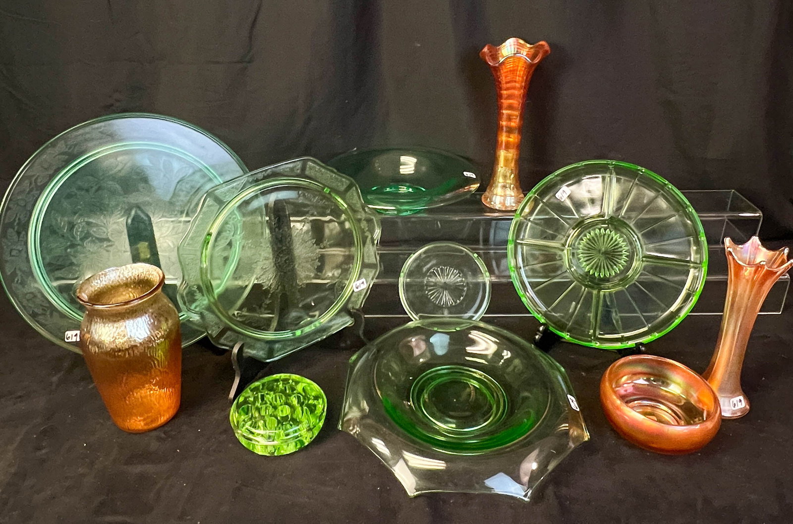 Group of Uranium and Merigold Carnival Glass c.1920-1940's: This mixed group of uranium and carnival glass includes a large urnanium centerpiece bowl (11" across), a 13" footed plate, an 11" petite four plate with handles, a large frog, a segmented relish tray