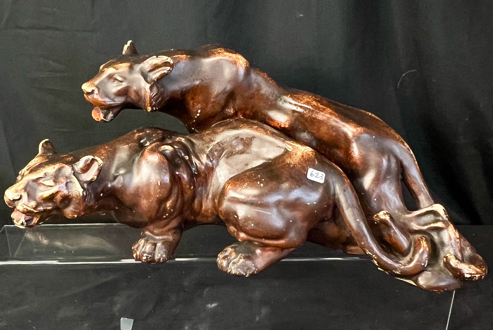 Plaster Panther Sculpture C. 1950s: A plaster statue depicting two panthers from the 1950s. Statue has some minor age wear and has an old repair on one leg but still presents very well. Measures 9.25" tall X 22" across X 9" deep.