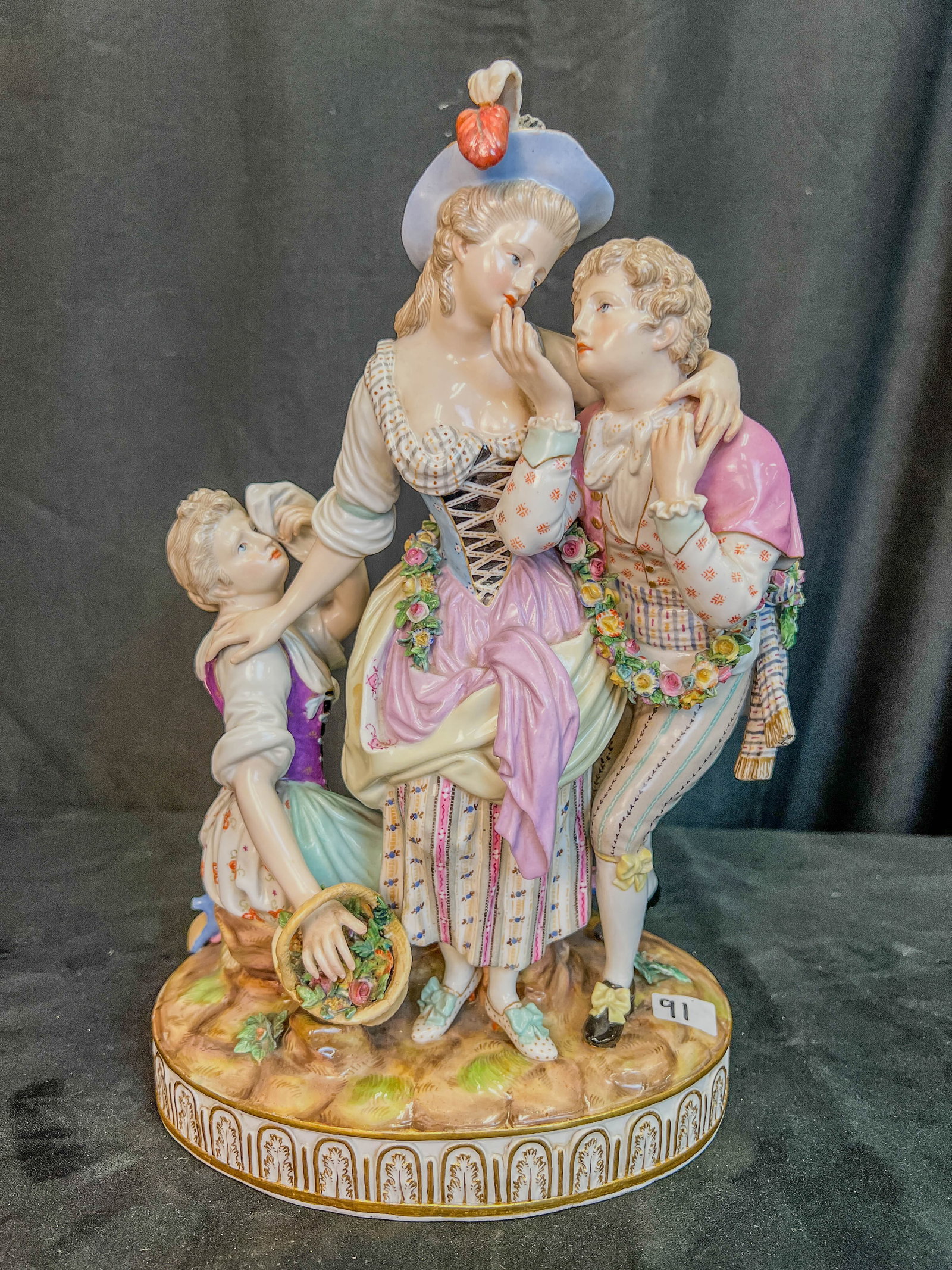 Meissen Porcelain Multiple Figure Figurine of Important Size c.1840'/50's: This outstanding multiple figure Meissen porcelain Figurine of important size features 2 women fighting over the attentions of a man. It has the crossed swords hallmark on the bottom. It is missing ha