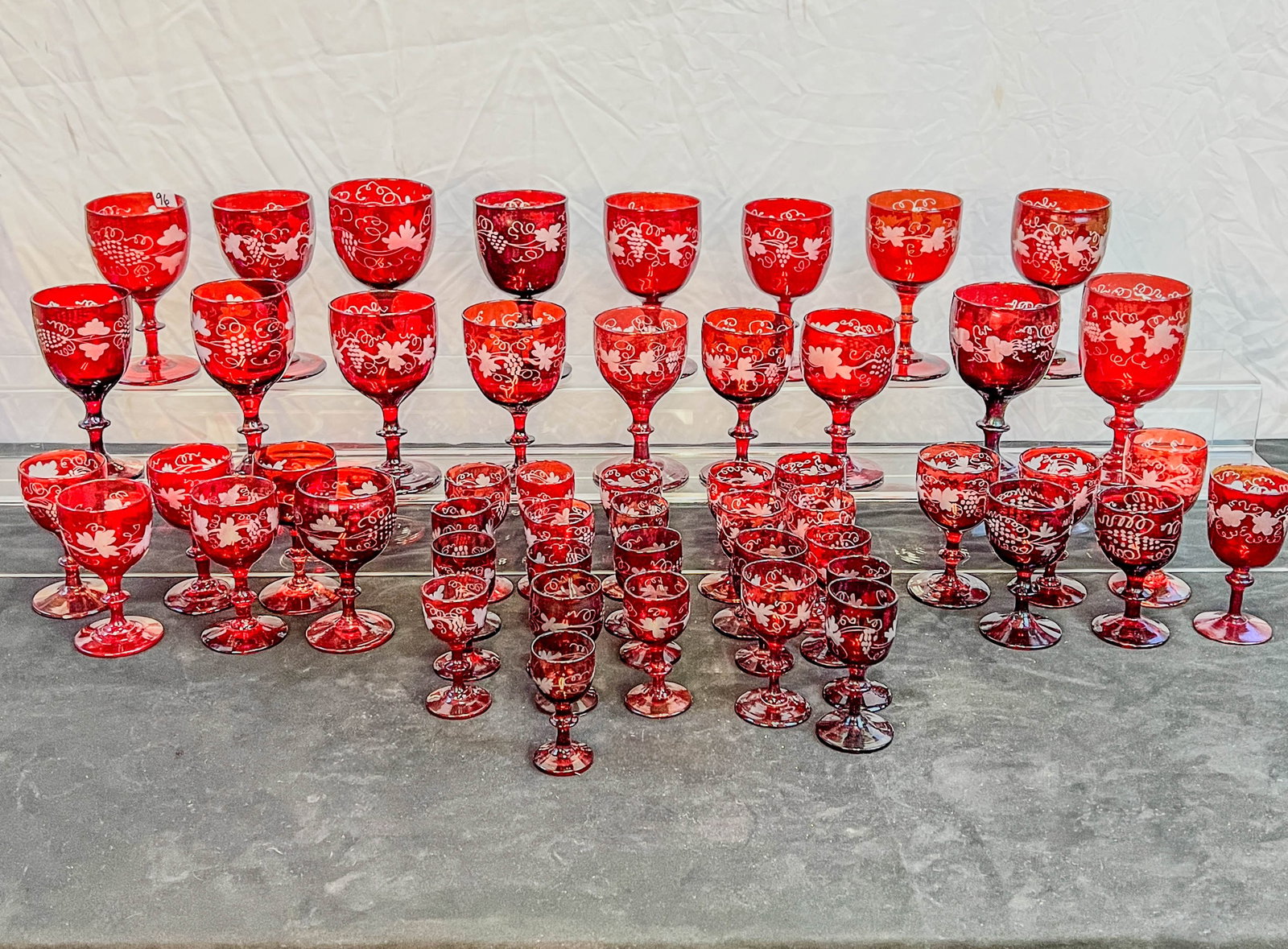 Ruby Cut to Clear Wine Goblets, Cordials C.1840/50's: A large set of handblown ruby cut to clear goblets, port glasses and cordials. A great collection of American Bohemian style glassware, it is rare to find pieces like this in such a large quantity. Ea