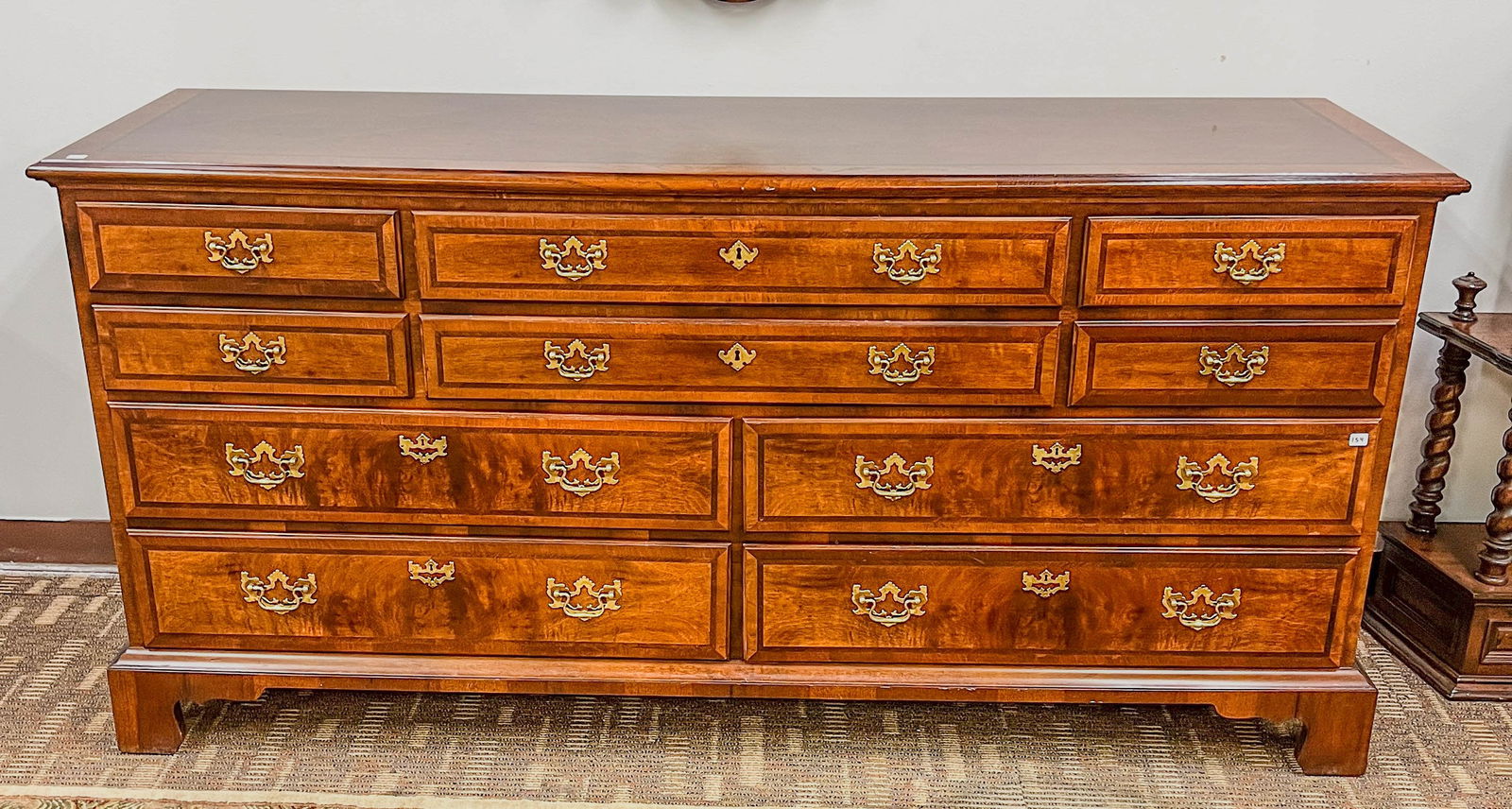 Henredon Chippendale Long Dresser: A Henredon banded mahogany Chippendale long dresser with 10 drawers on bracket feet. Piece retains original hardware and measures 34" tall X 70" across X 20" deep.