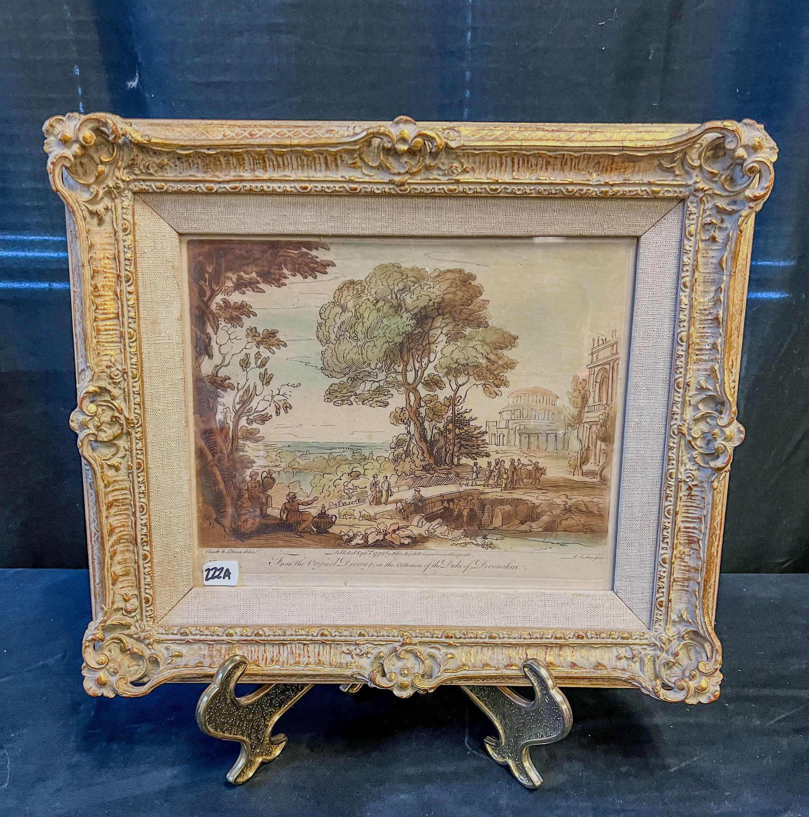 John Boydell English Hand Colored Engraving C. 1775: A John Boydell English hand colored engraving in quality frame. Engraving comes from a drawing in the collection of The Duke of Devonshire. Framed, this piece measures 13" tall X 15" across.