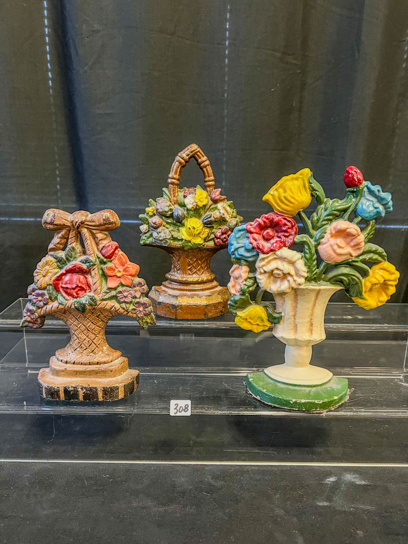 3 Cast Iron Floral Basket Doorstops: These 3 cast iron floral basket door stops are in excellent original condition and measure approximately 7" tall