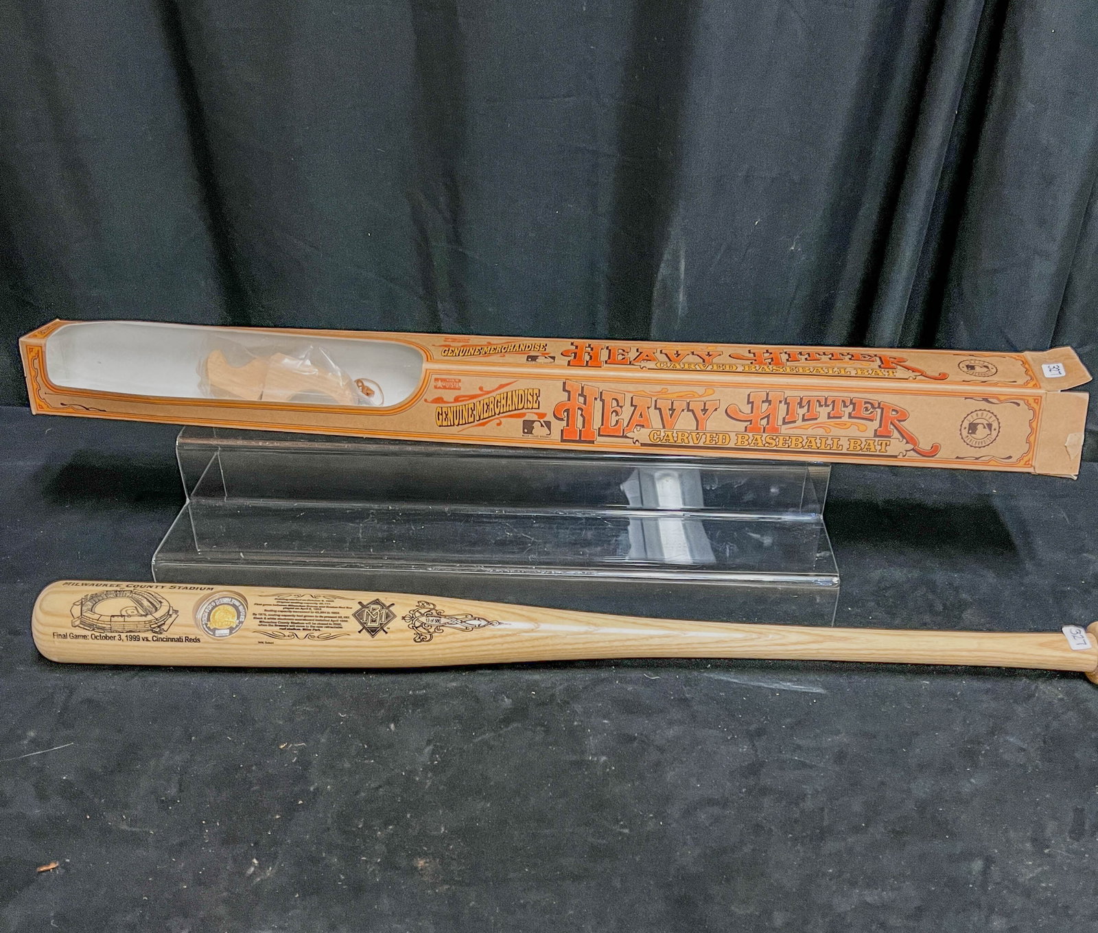 Heavy Hitter Baseball Bat Milwaukee County Stadium: A commemorative Heavy Hitter baseball bat commemorating the last game held at Milwaukee County Stadium. Bat has a one ounce silver coin with 14k overlay center embedded in bat. Comes with original box