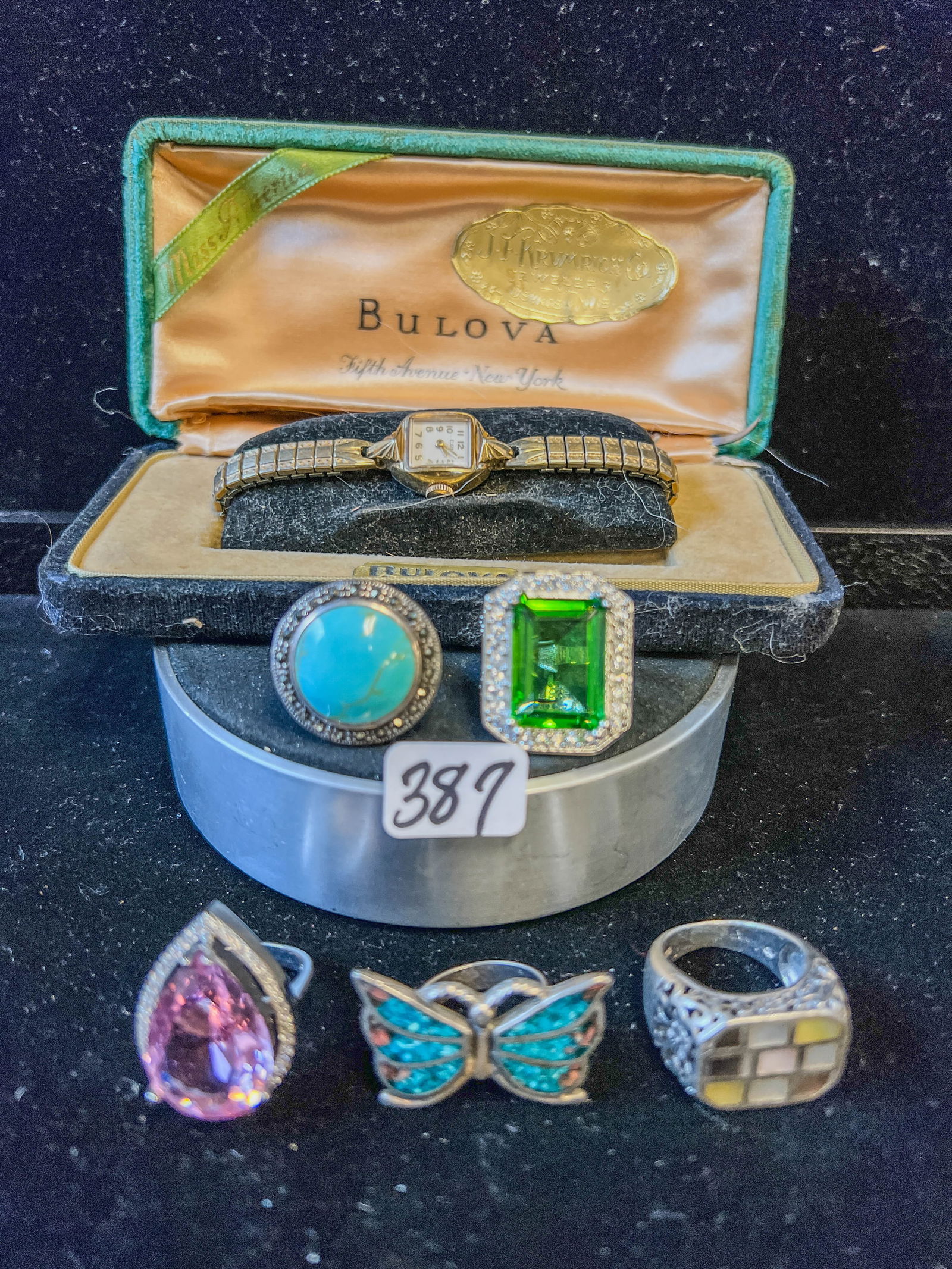 Group of Sterling Rings and Ladies Elgin Watch: A group of 5 sterling rings (42.36g with stones) along with a vintage rolled gold ladies Elgin watch in vintage Bulova case.