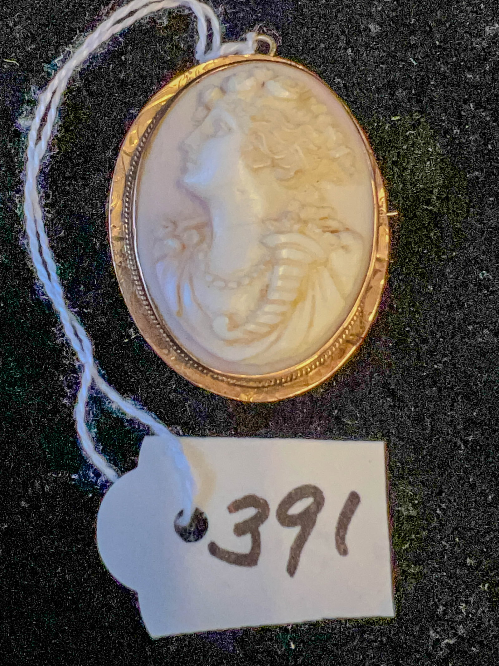 Edwardian 10k Gold Carved Cameo Brooch: An Edwardian 10k gold carved cameo brooch. Woman has cornucopia and roses in hair, brooch weighs 15.88 grams.