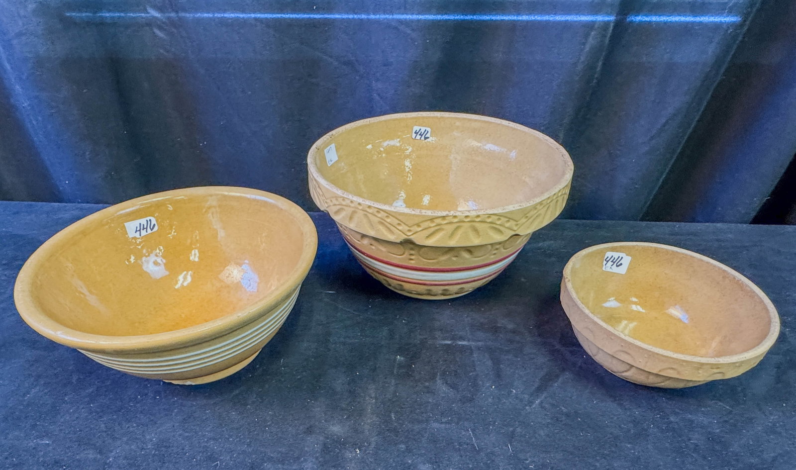 3 Graduated Stoneware Mixing Bowls: A group of 3 graduated stoneware mixing bowls.