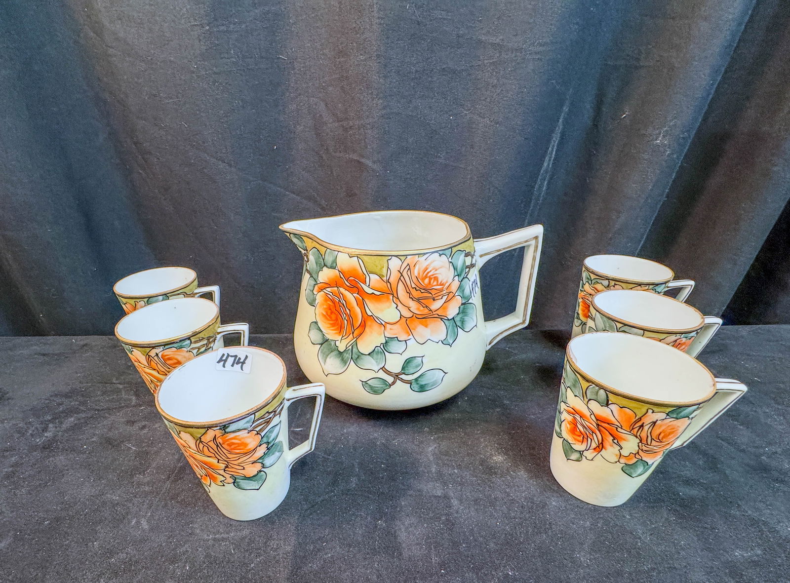 Signed Nippon Pitcher and 6 Mugs: A set of signed floral Nippon to include a pitcher along with 6 matching mugs.