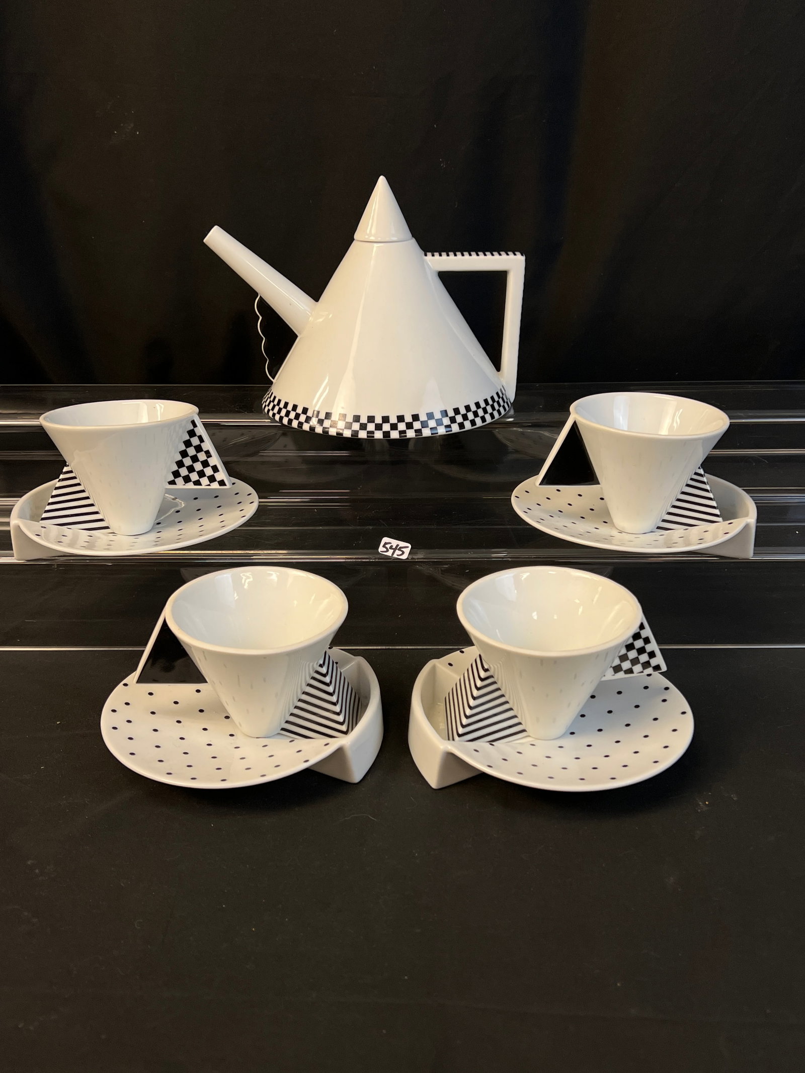 Helena Uglow Memphis Mikasa Millenium Teapot and 4 Matching Cups and Saucers: This unusual black and white Memphis Millenium Teapot is by designer Helena Uglow for Mikasa, has its 4 matching teacups and under saucers. All in excellent condition, teapot measures 7" tall, cup and