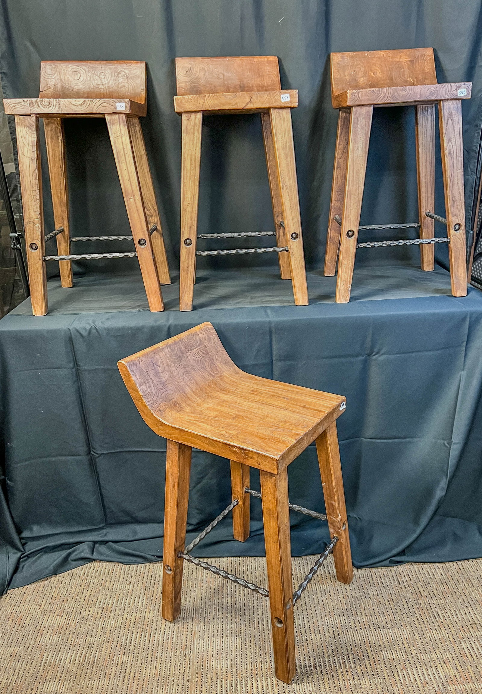 4 Joss & Main "Carlson" Reclaimed Wood Stools Short: These 4 reclaimed wood stools are by Joss and Main in the "Carlson" style. They each have barley twist iron foot rest/stretchers and measure 29" tall X 13.5" across X 17.5" deep.