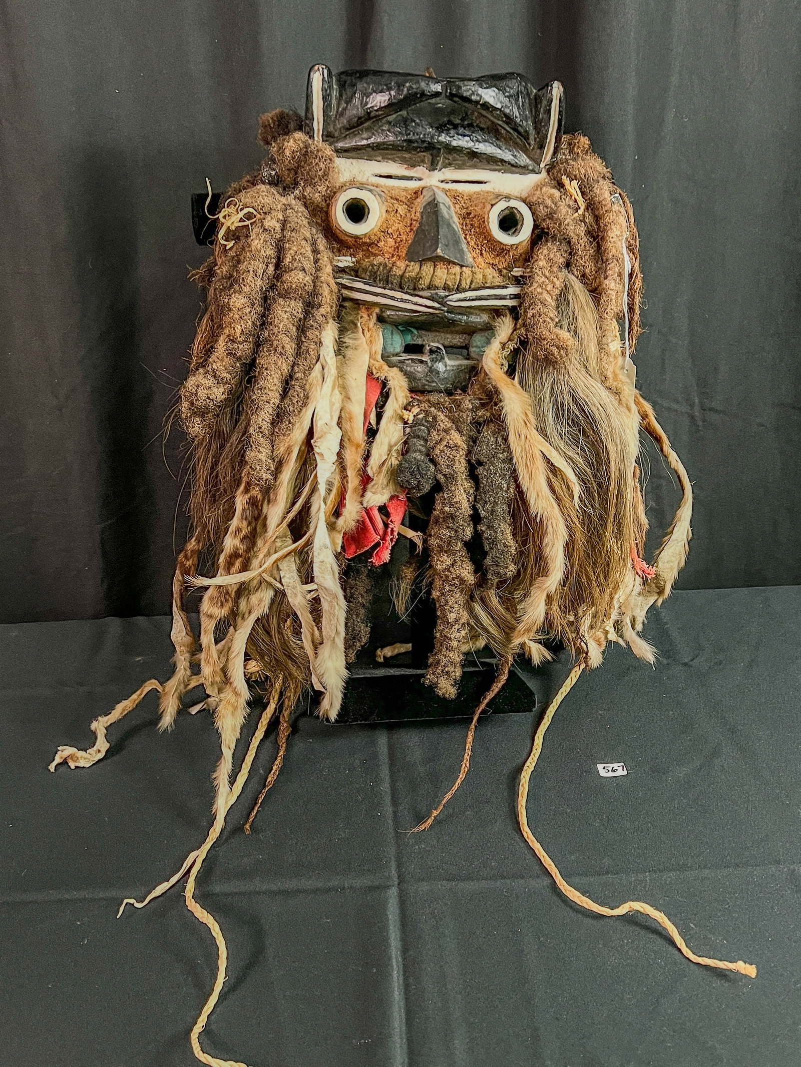 African Guere Wood and Hair Ceremonial Mask: This unusual African mask is made of carved painted wood, animal skins, and locks and braids of human hair. It is from the Guerres people living in Liberia, also known as the Kran. This would be used 