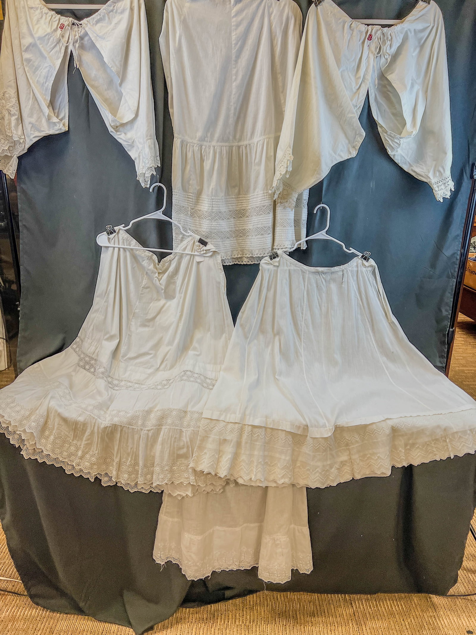 Group of Victorian Cotton Bloomers and Petticoats: This group of Victorian cotton undergarments include 2 pairs of monogrammed ladies cotton bloomers with lace edged legs in good condition, and 4 lace trimmed petticoats, 3 very good condition, one has