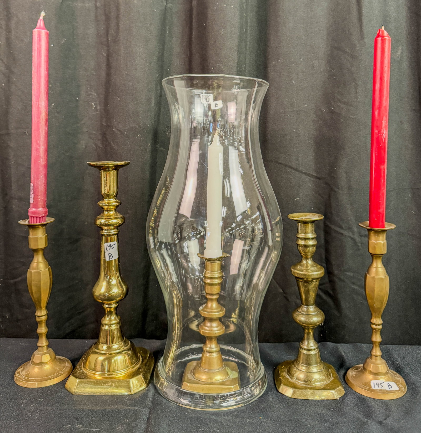 Hand blown 18th century candle globe with candle sticks: A hand blown 18th century candle globe in Excellent condition the globe measures 17.5" tall along with a selection of antique and contemporary brass candle sticks some with pushups.