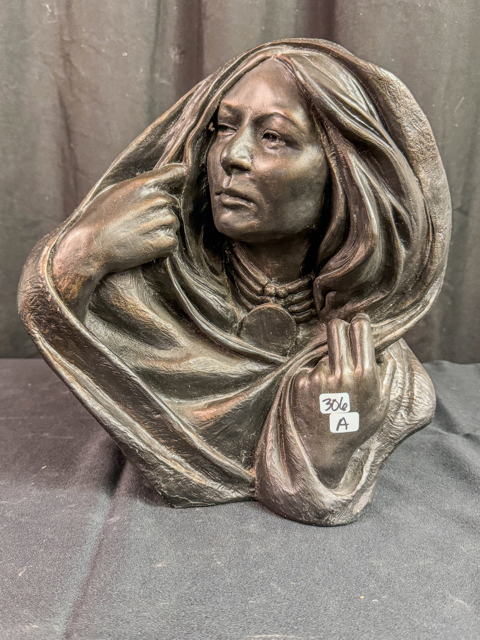 A Terrance Patterson bust of a Cheyenne Female: A Terrance Patterson bust of a Cheyenne female in titled "Cheyenne Winter" 18/500 made in 1983. It measures 12.5" tall by 11" across.