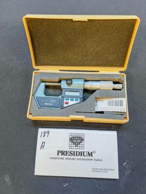 A Mitutoyo 293-761 Digital 0"-1" Outside Micrometer with another micrometer