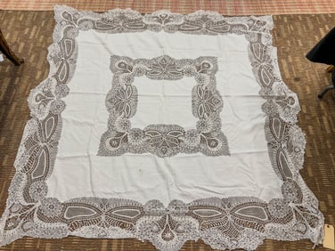 A very elaborate cut work and heavy laced table cloth