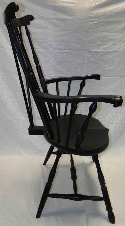 Black Windsor armchair. Measures 44.5" high x 27.5" wid: Black Windsor armchair. Measures 44.5" high x 27.5" wide w/ seat depth of 18". Est value $100-125