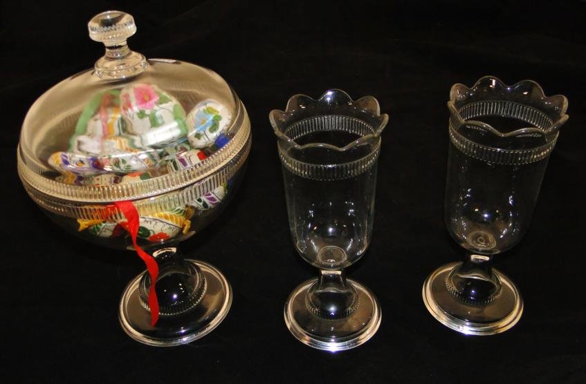 Early pressed glass covered candy and two celery holder: Early pressed glass covered candy and two celery holders along with a pressed glass reindeer dish. Est value $
