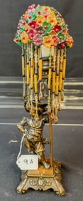 Bronze Figural Candle Stick Depicting an Elaborately Dressed Child Soldier with Beaded Shade
