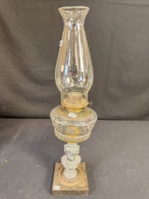 Figural Oil Lamp of a Pressed Font