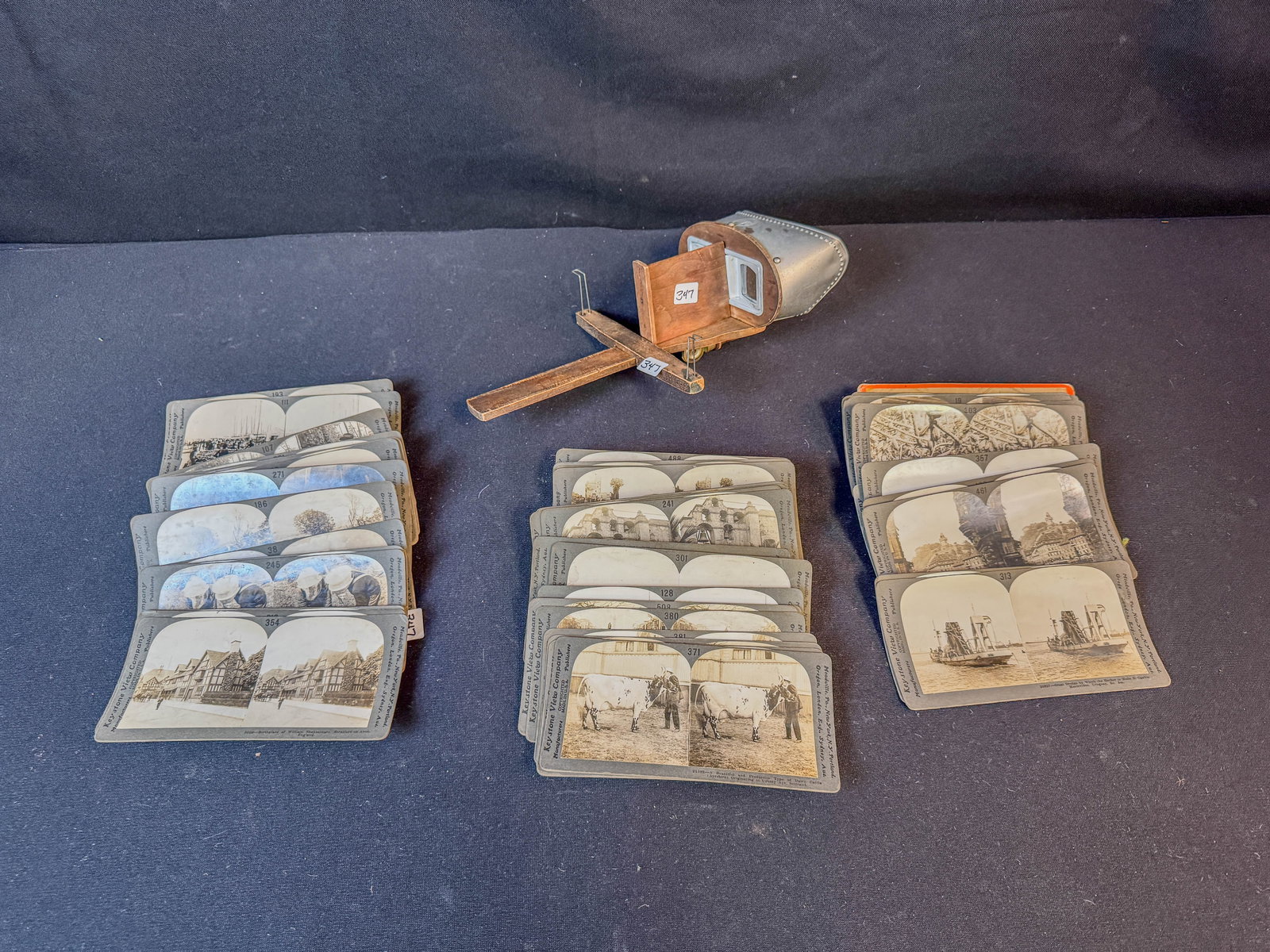 Stereopticon with Viewing Cards: A stereopticon with western, street scenes and other viewing cards, in excellent working condition.