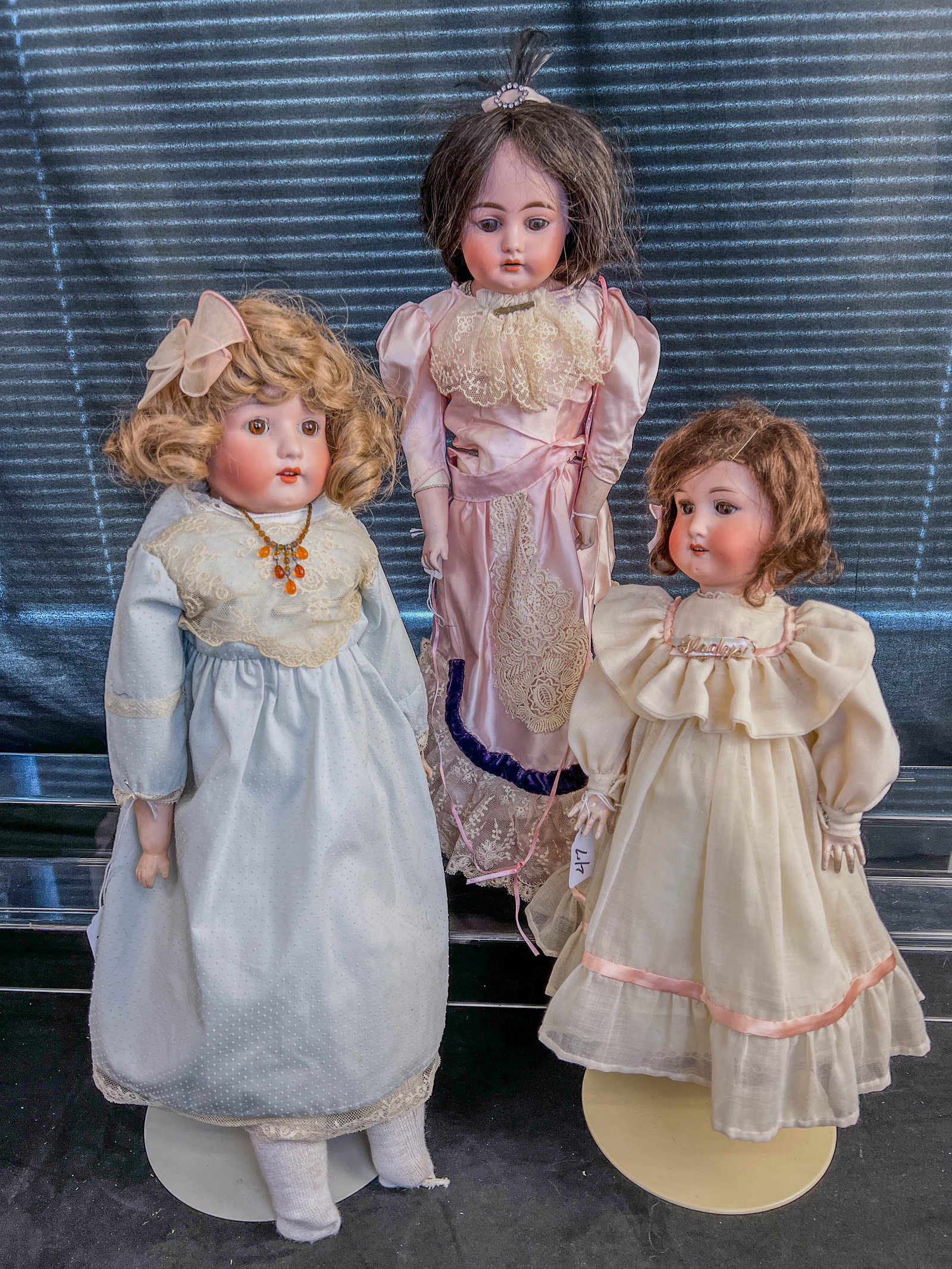 3 Ernst Heubach German Bisque head Dolls c. 1900-1920's: These three Antique signed Ernst Heubach lady dolls c. 1900-1920's include a 21" tall Heubach doll with horsehoe mark, brown sleep eyes, open mouth, human hair wig, nice kid body, a pink satin lace tr
