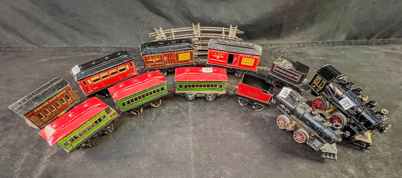 2 Prewar American Flyer egines, TIn Litho cars, Marx, Hornby, Track: A group of Prewar O scale trains to include 2 American Flyer cast key wind engines (wheels turn when wound), red Horby tender, black American flyer tender, 1 tin litho A.F. passenger car, 2 A. F. US R