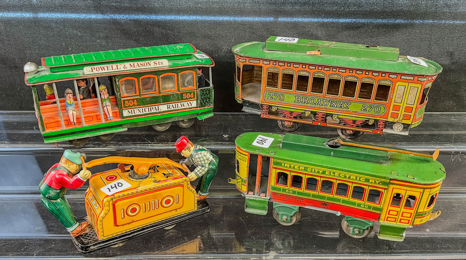 Tin Litho Streetcars, More!: This group of Tin Litho Streetcars inlcude a San Francisco Cable car friction toy with 3 dimentional figures riding it c.1960's, a Joseph Chein Broadway 270 street car c.1920's (missing the electric l