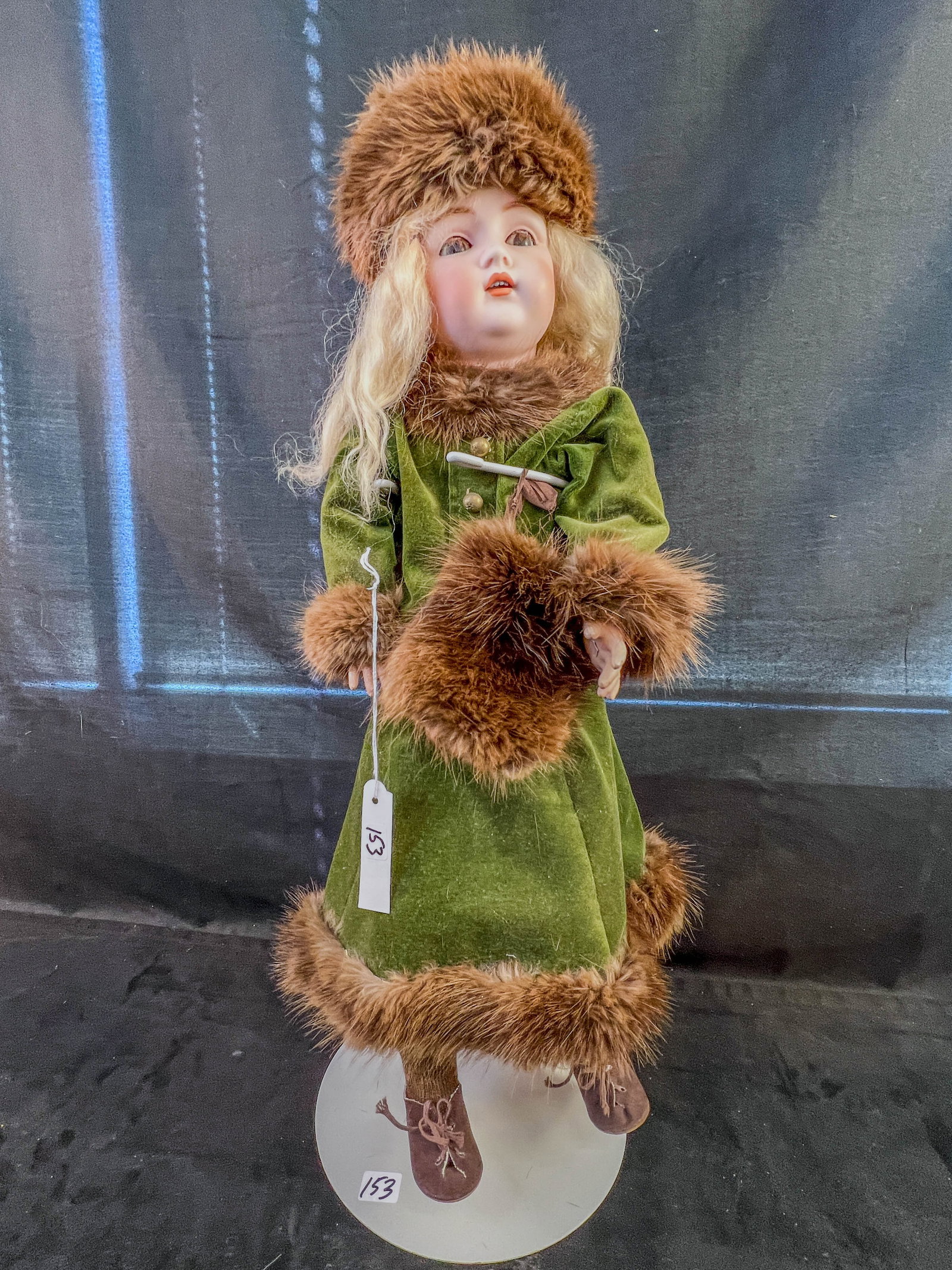 Victorian Kestner Bisque Head Doll: A 21" tall Kestner bisque head doll marked JDK 214 on a nice jointed composite body (probably original), mohair wig, sleep eyes and open mouth. Doll is wearin a olive green velvet outfit trimmed in re