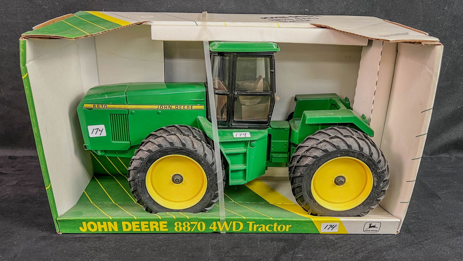 Ertl Die Cast 1/16 Scale John Deerer 8870 4WD Tractor: An Ertl Die Cast 1/16 Scale John Deerer 8870 4WD Tractor, part of Ertl's PRestige Collection c.1993. In it's origianl box, unused.