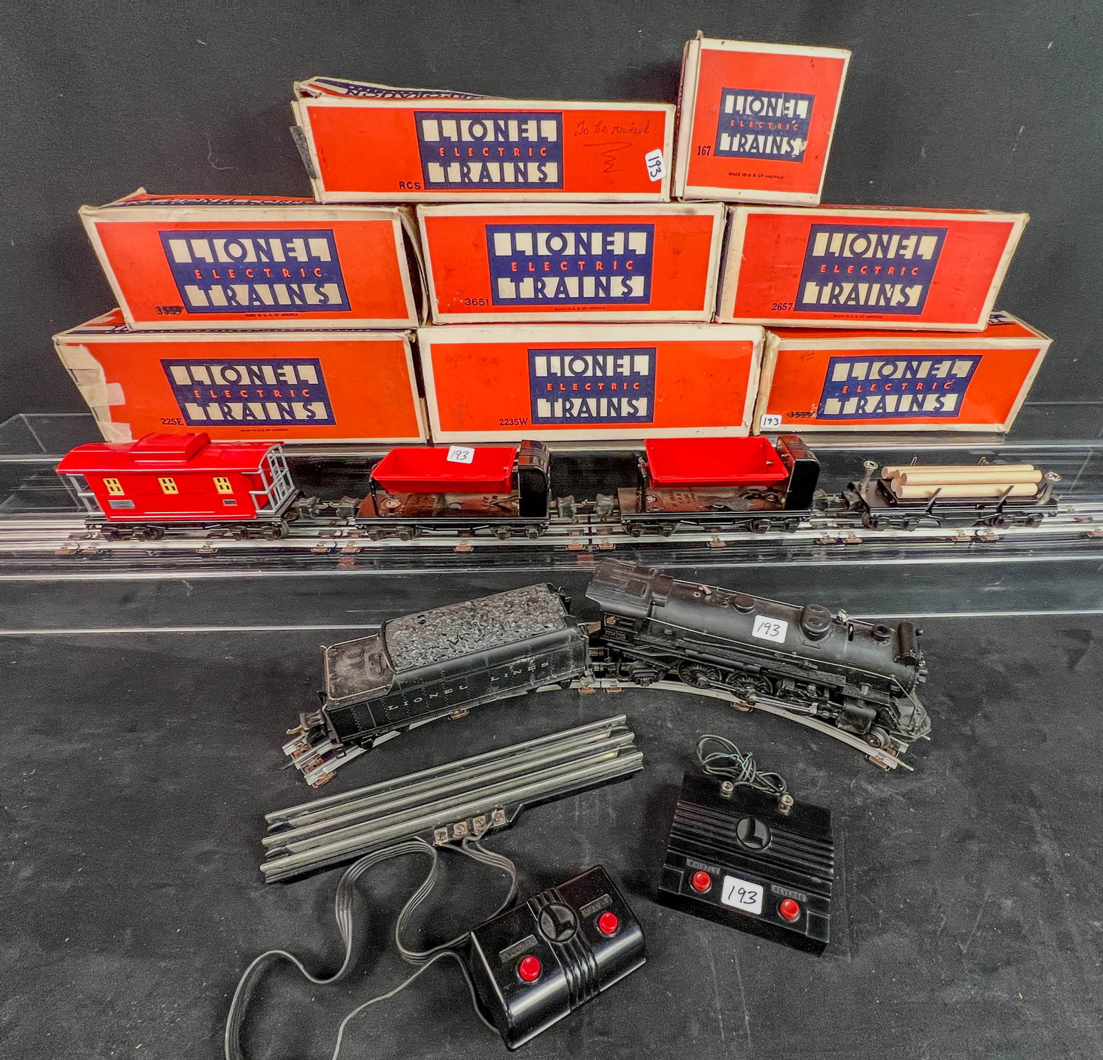 Group of Vintage O Gauge Lionel; Train Cars in original Boxes 1940/50's: A Group of Vintage O Gauge Lionel; Train Cars in original boxes c. 1940/50's to include a 225E Engine in orig box c.1938-1942, two #3659 Coal Dump Car, 3`167 Whistle Controller, 33651 remote control l