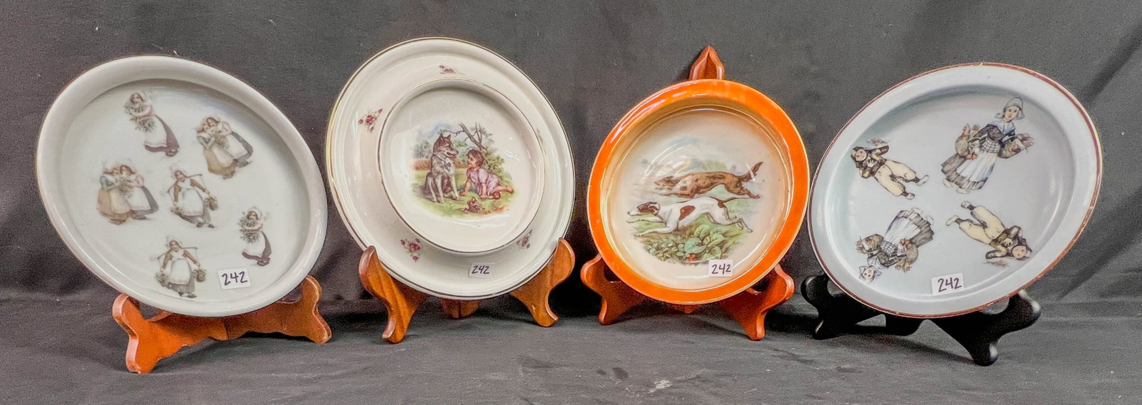 4 Antique German Porcelain Baby Bowls: 4 Anitique German made porcelain baby feeding bowls to include a7.5" across Retch and Co. bavaria bowl with 2 hunting dogs running and pictures of toys aeround the outside rim c.1910, a 7.5" across He