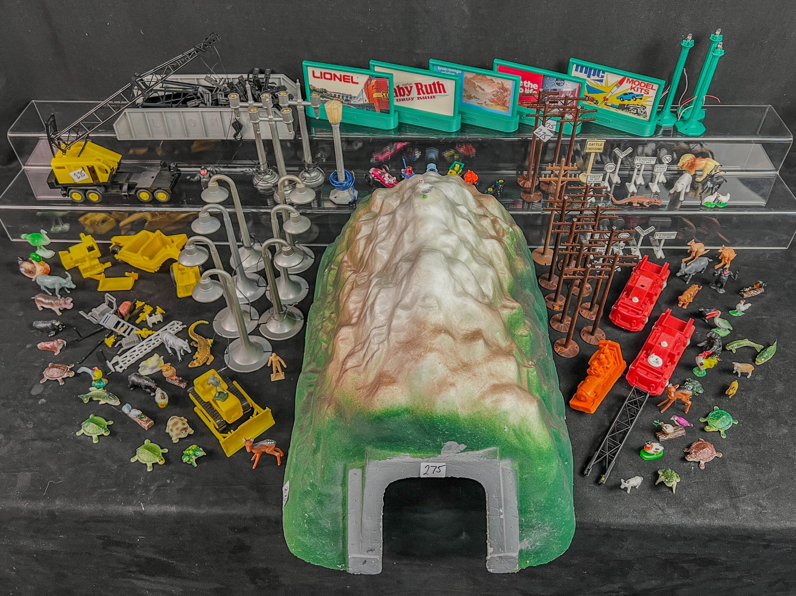 Vintage Train Accessories, Marx, Lionel, More!: A group of plastic vintage O Gauge trtain accessories to include Marx electrified plastic streetlamps Lionel plastic trucks including a Harnishfager crane, 2 Plasticville fire trucks, 5 Lionel Billboa