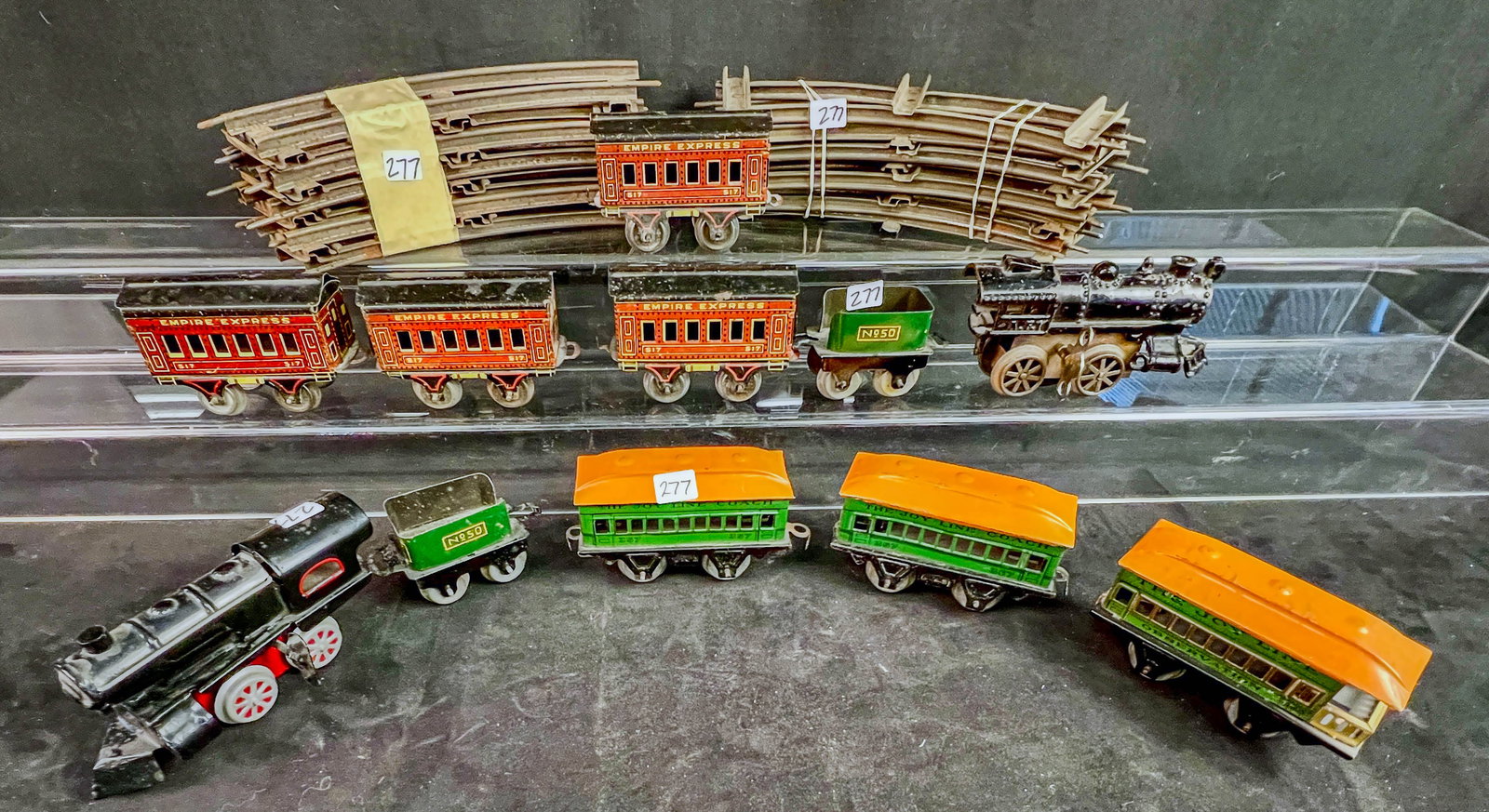 2 Prewar Tin Litho O Gauge Clockwork Trains,Cars, Tracks: 2 pre-war tin litho O gauge Clockwork trains to incliude a Karl Bub pressed tin key wind engine, a green American Flyer Hummer Tender, 4 American Flyer tin litho Empire Express #517 passenger cars, an
