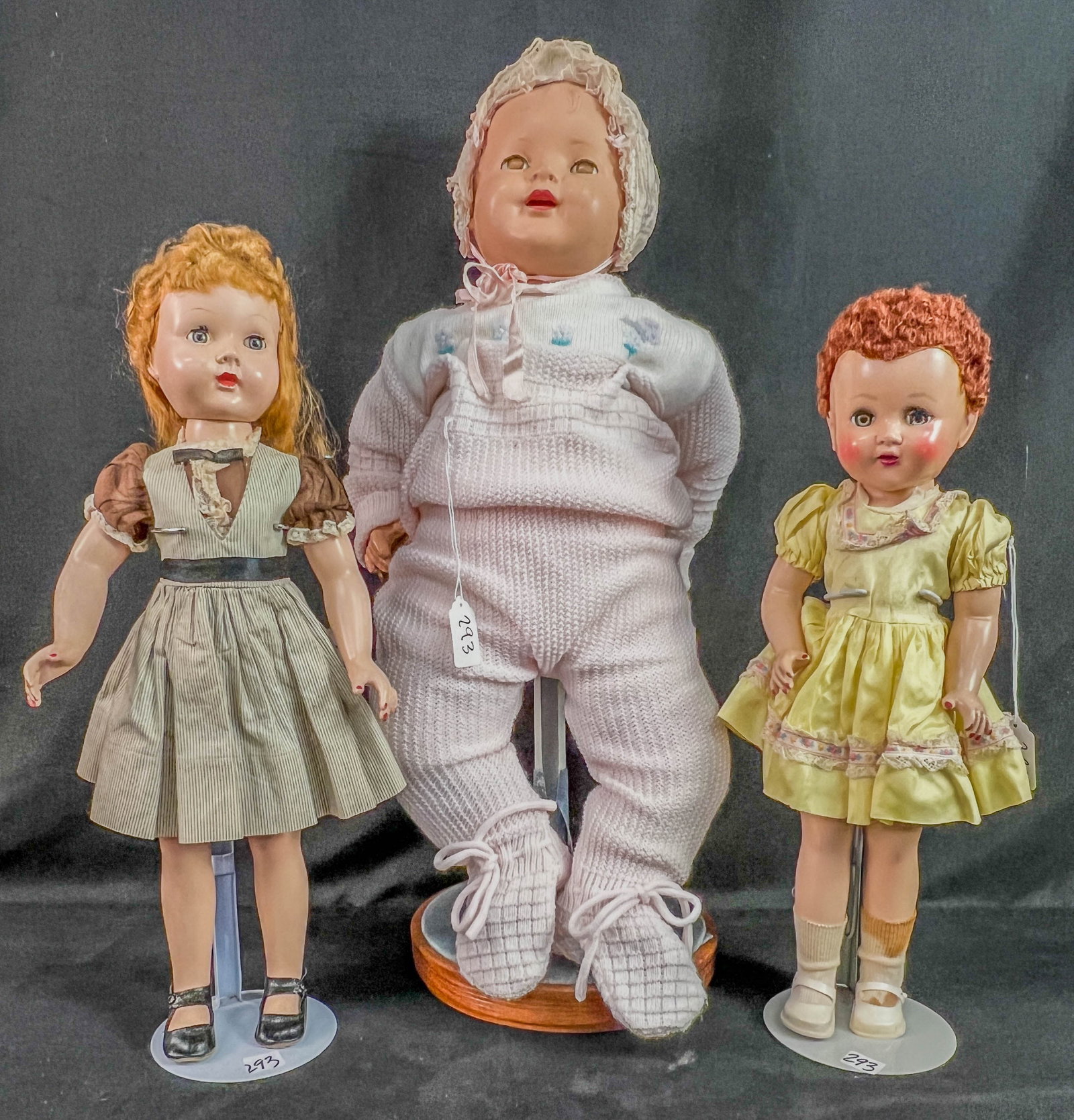 Group of 1950's dolls , Horsman, Walker: a group of 3 1950's dolls rto oinclude an 18" tall Horsman hard plastic , taped arm soocket, sleep eyes, repainted fingernails and lipos, an 18" hard plastic Walker doll with sleep yes, and a 21" tall