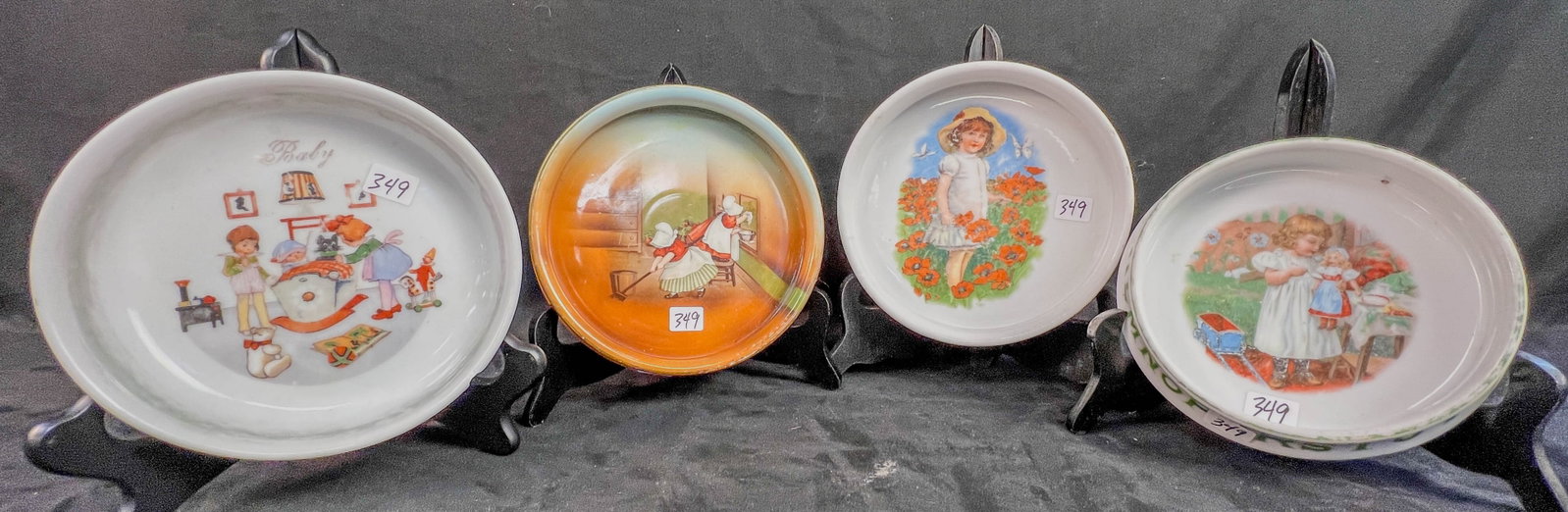 4 Antique Porcelain Baby Bowls: 4 antique porcelain baby bowls to include a Royal Bayreuth Sunbonnet babies bowl, turn of the century German transferware bowl with little girl holding a doll, a 1920's Czech bowl with kids playing wi
