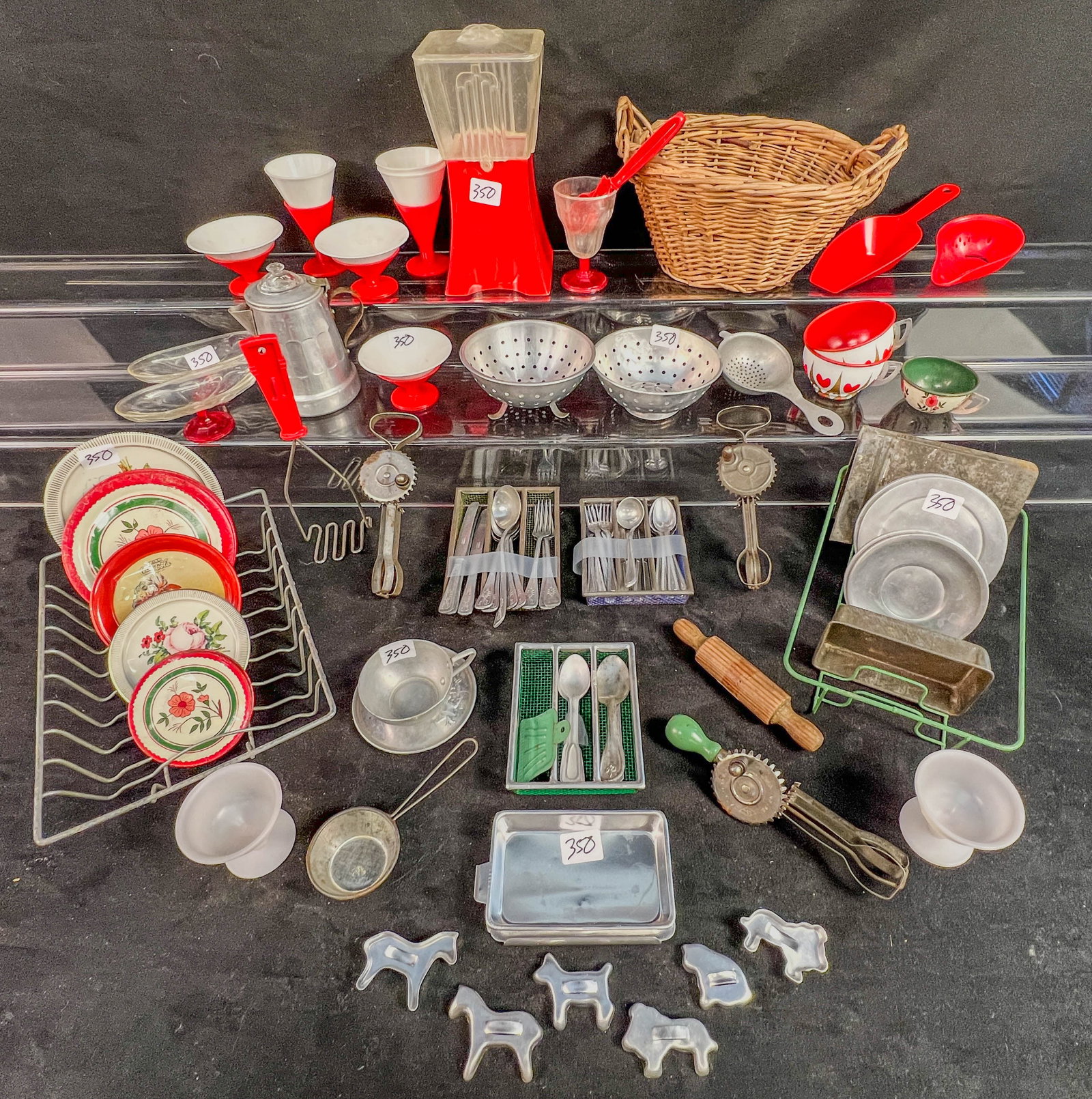Vintage Group oF Doll Kitchen Items c.1930-50's: A Large group of Vintage tin, aliminum, and plastic doll kithc en items to include 3 egg beaters, 2 colanders, coffee pot, silverware and silver wear holders, 2 sink drying racks, cookie sheets, oven
