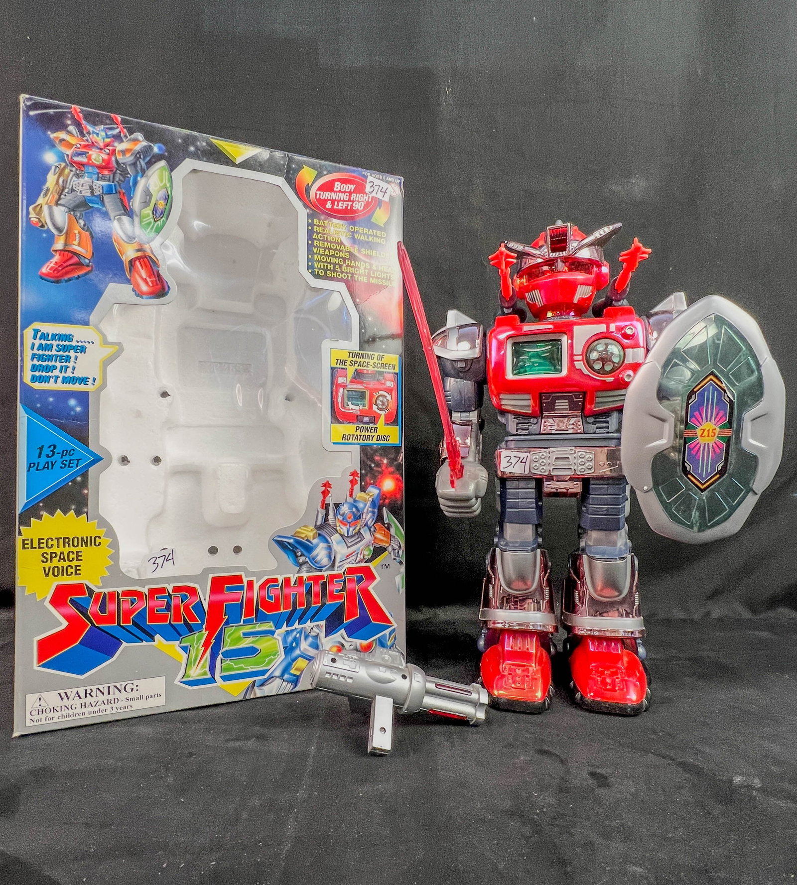 Hap-P-Kid Wang Kwong Super Fighter Electronic Robot C1997: A 1997 15" tall Hap-P-Kid Wang Kwong Super Fighter 15 Model 337S Space Robot that walks, space voice, moving hands and head, bright lights, and shoots the missile. It is New in it's original box.