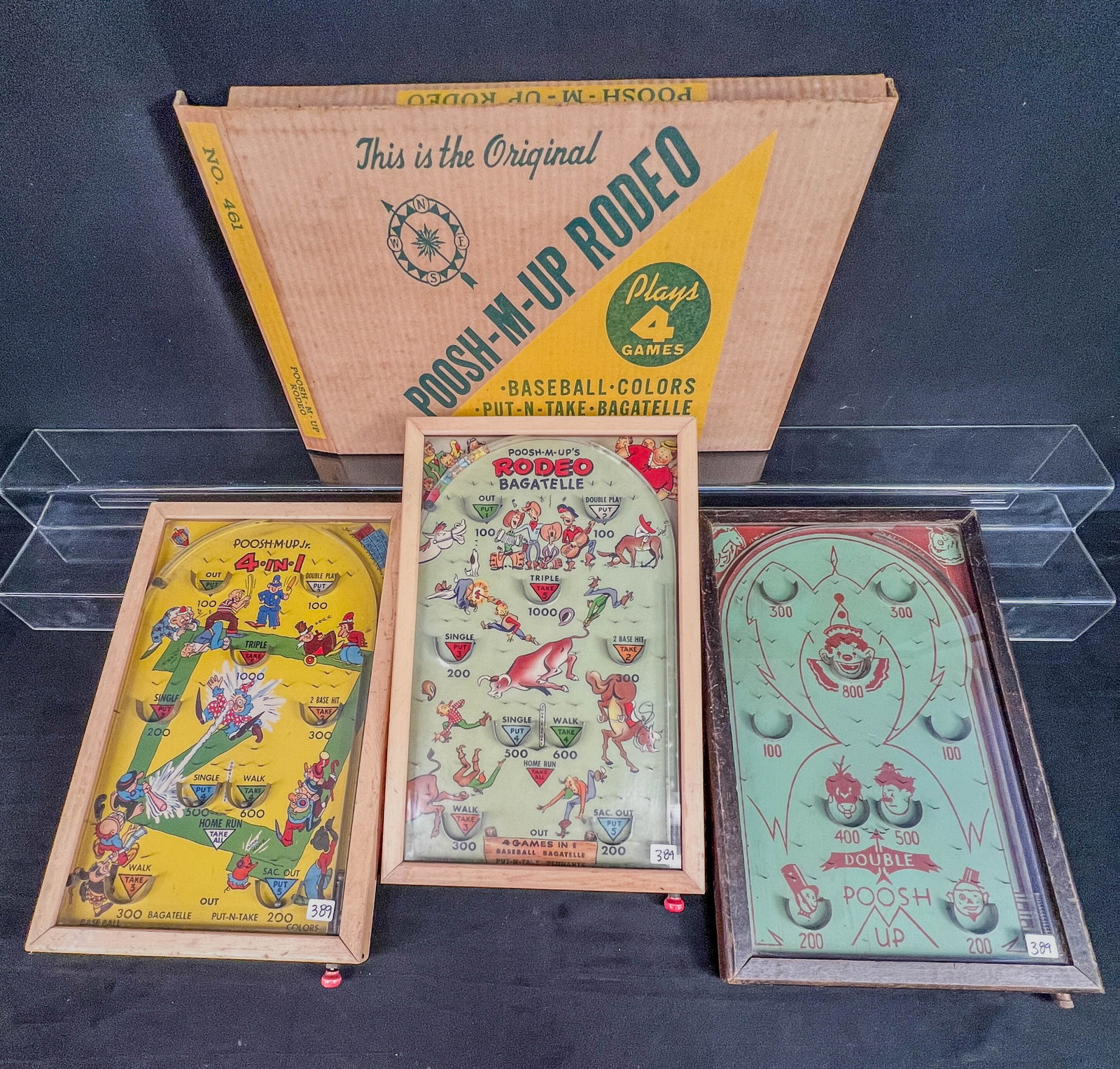 3 Tabletop Pinball Games C1930's, Northwestern POOsh-M-UP Rodeo in Original Box, mofe!: A group of 3 table top pinball games to include a 1930's Poosh-M-Up JR. 4 in ! in very good conddition, a 1930's Push-M-Up Rodeo Bagatelle, both with thier steel balls, and a Northwestern Mailbox comp