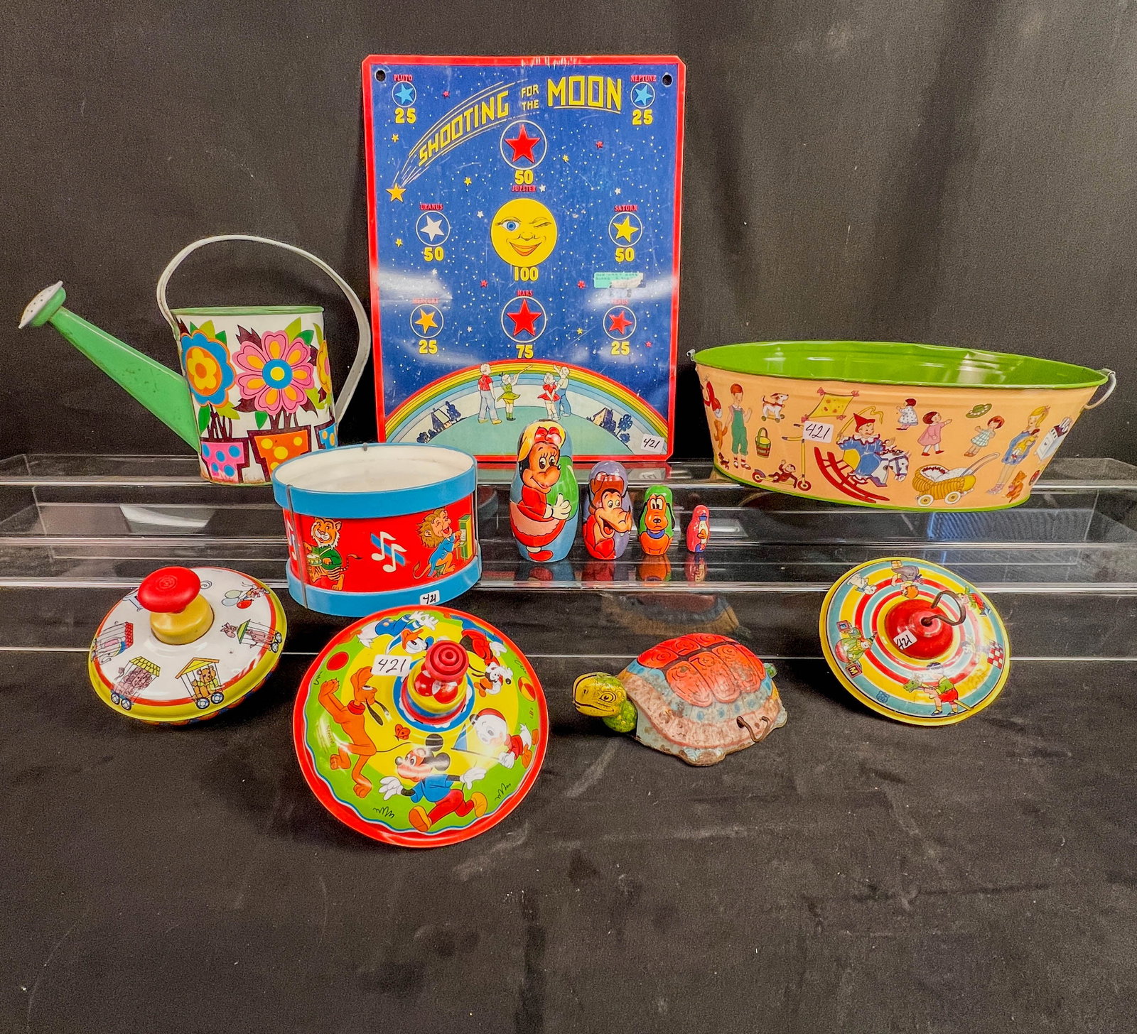 A group of Ohio Art Tin Litho Toys, Tops, C.1930/60's, More!: A group of vintage Ohio Arts tin litho toys to include: a 1930's 6" tall spinning top by J. Chein, an Ohio Art 5" tall Circus Train spinning top , a USSR Norma toy wash basin with handles (missing one