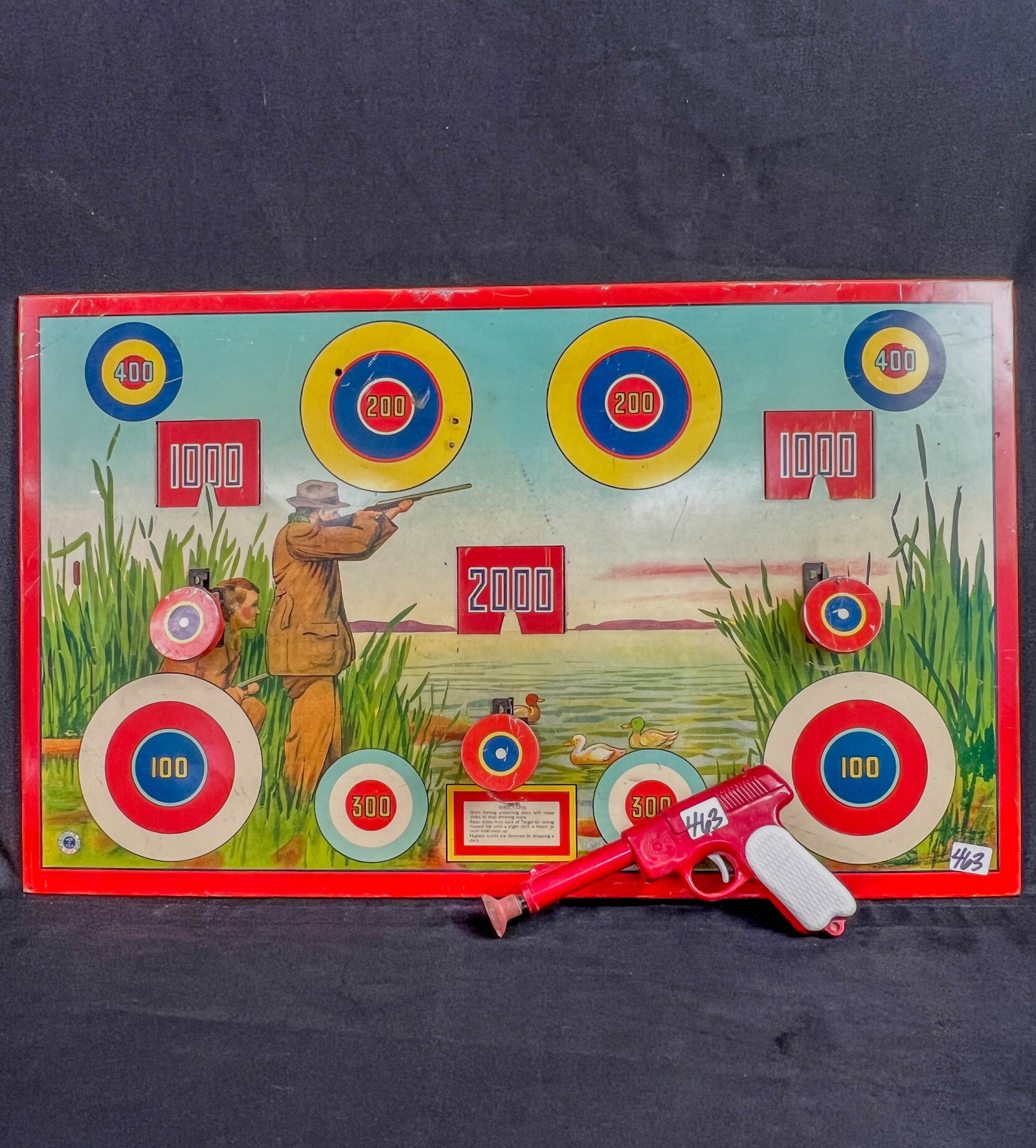 Wynadotte TIn Litho Duck Hunting Arcade Game c1930's: A 1930's Wynadotte tin lith duck hunting arcade game in very good condition (14" tall X 23" across), and a Wynadotte hard plastic dart gun.
