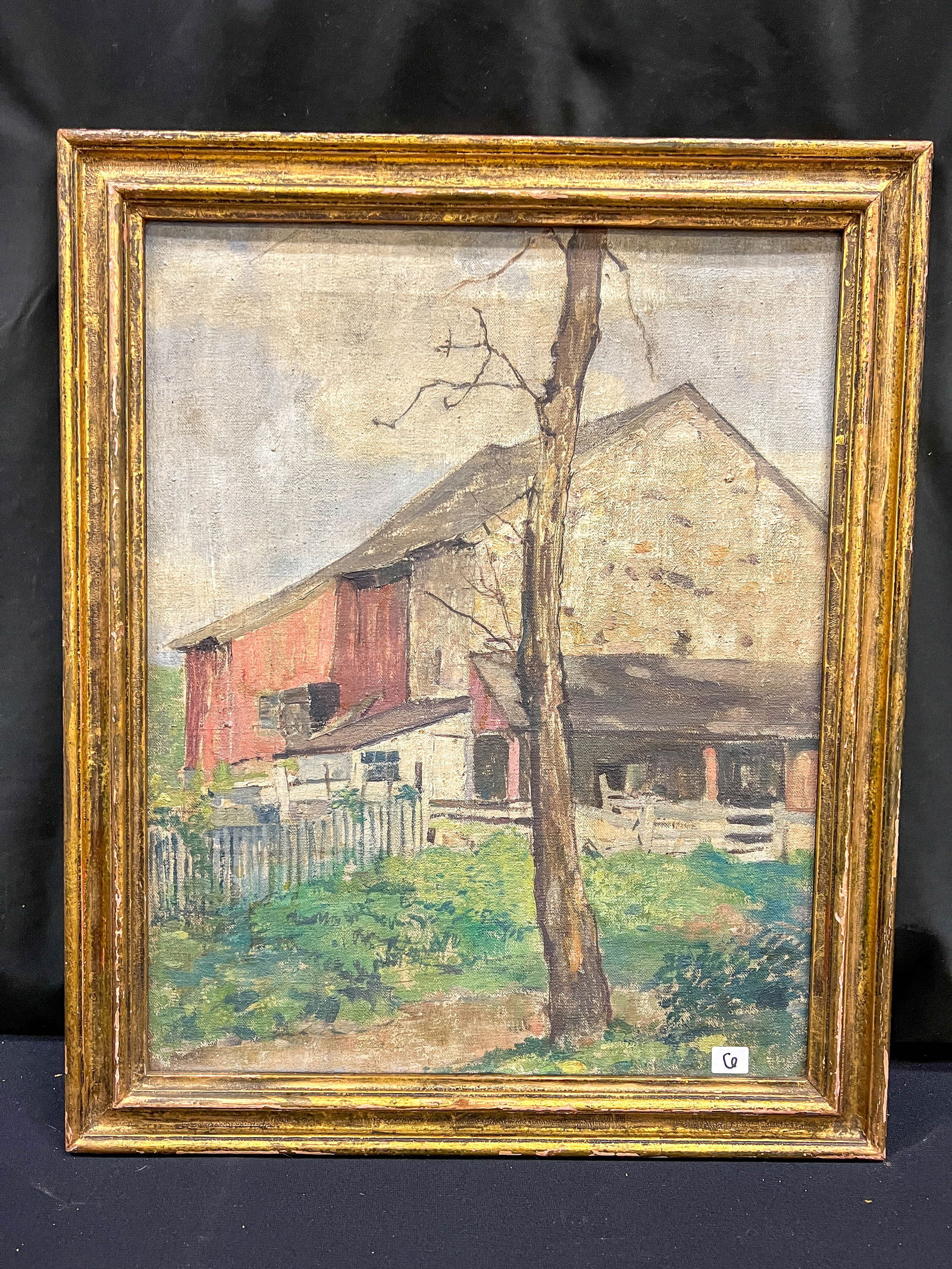 Pennsylvania Impressionist Oil on Canvas c1925 Attributed to Robert Spencer: A Pennsylvania Impressionist oil on canvas in a gilded period frame c. 1925 depicting an old barn as seen through a farmyard attributed to listed American Artist Robert Spencer (1879-1931). On the rev