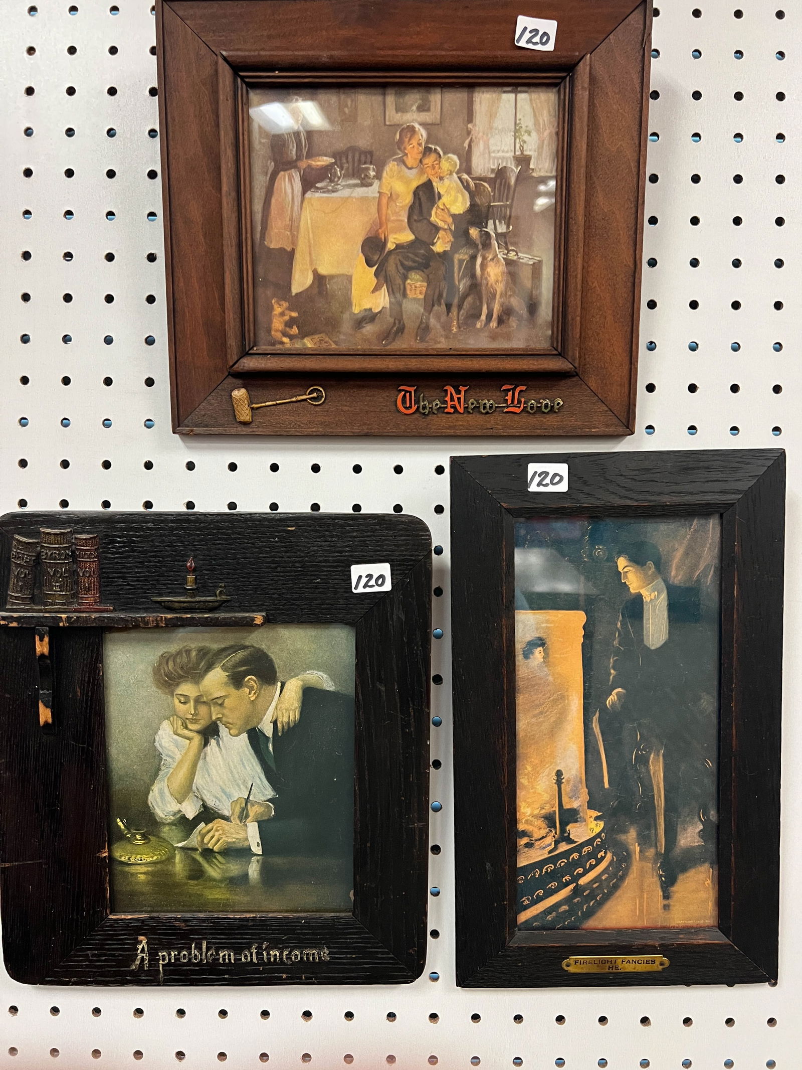 Three Mission Arts and Crafts Prints Fumed Oak With Molded Decorations: Three Mission Arts and Crafts Prints Fumed Oak With Molded Decorations to include: a fumed oak frame with molded decorations in the shape of books and a candle stick that reads A Problem of Income pri