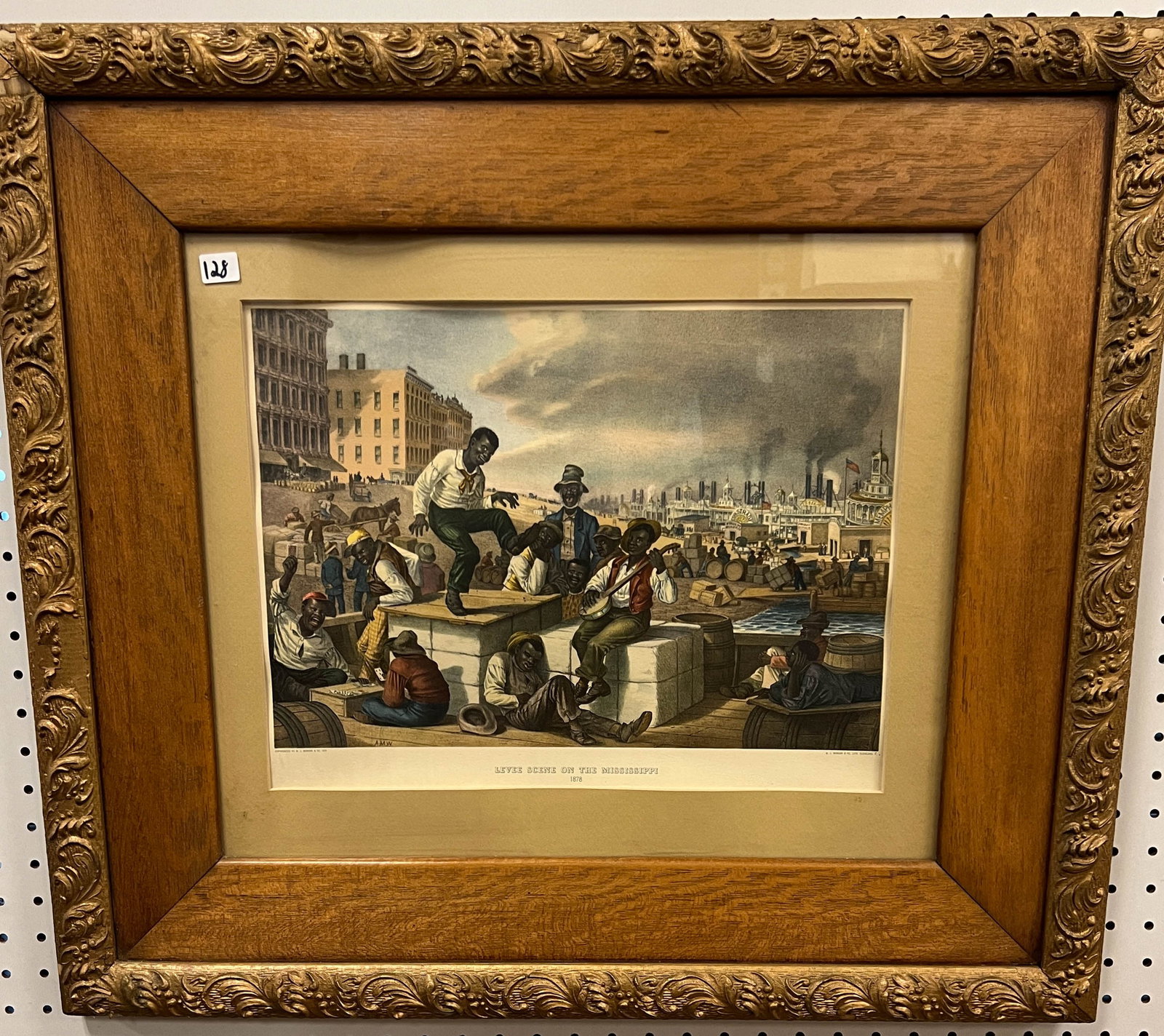 Larged Framed Black Memorabilia: Large Frame black memorabilia titled Levee scene on the Mississippi 1878. Copyright by W. J. Morgan & Co 1878. Elaborate oak and gesso frame. W. J. Morgan & Co. Lith. Cleaveland O. It is in great cond