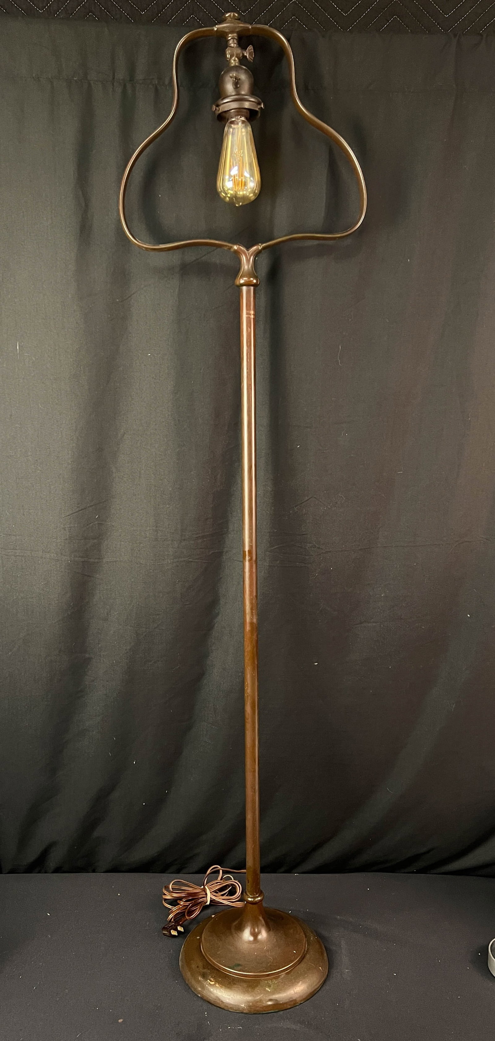 Handel Bronze Floor Lamp C1910: Floor standing Handel harp lamp all original with signature on the bottom of the lamp. It has patina. It is in excellent condition. It measures 56" tall x 13.75" wide.